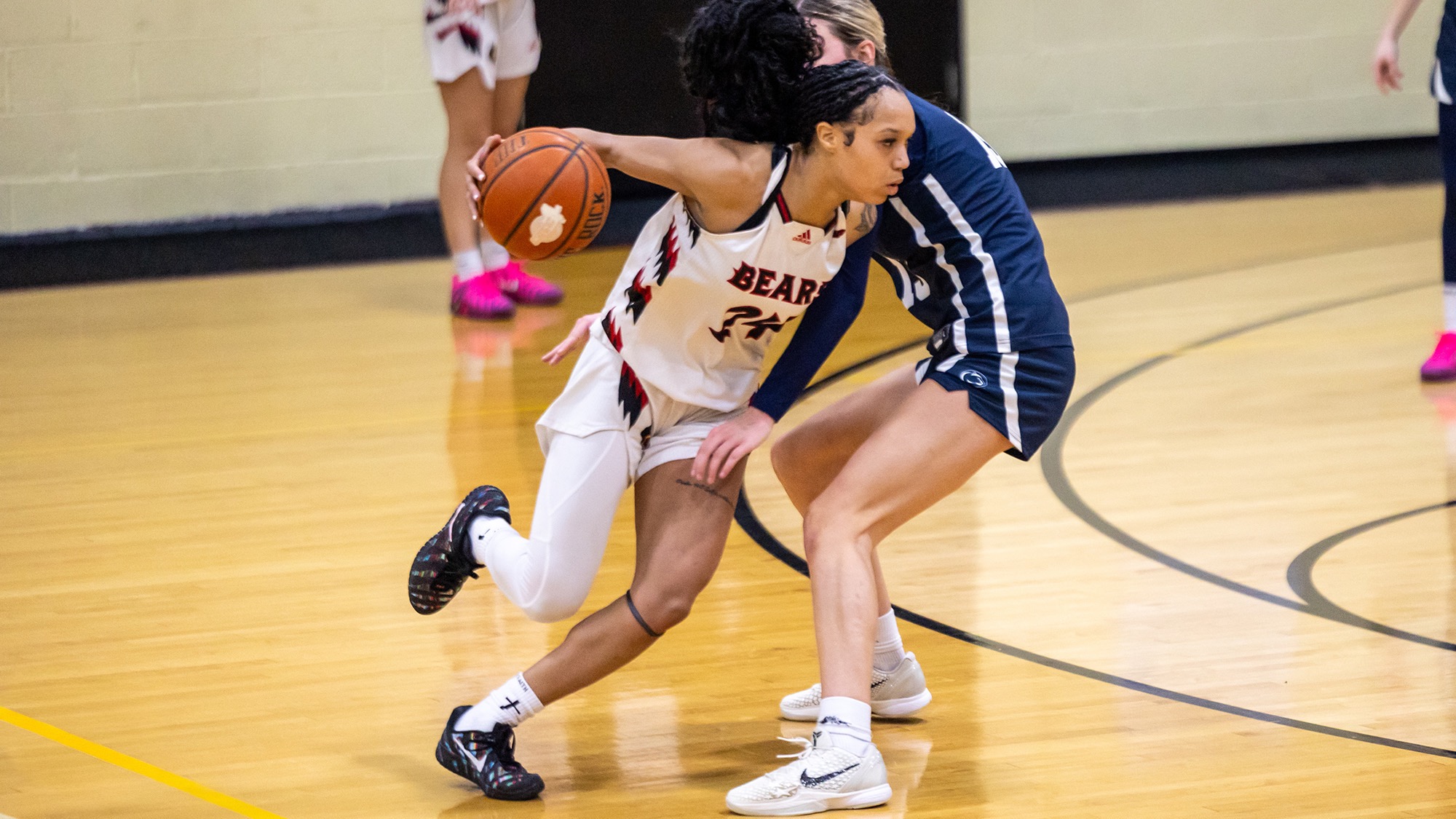 Nia Mallette goes by her defender on the basketball court