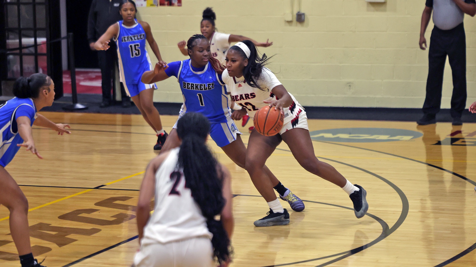 Anisha Able drives to the basket against Berkeley College
