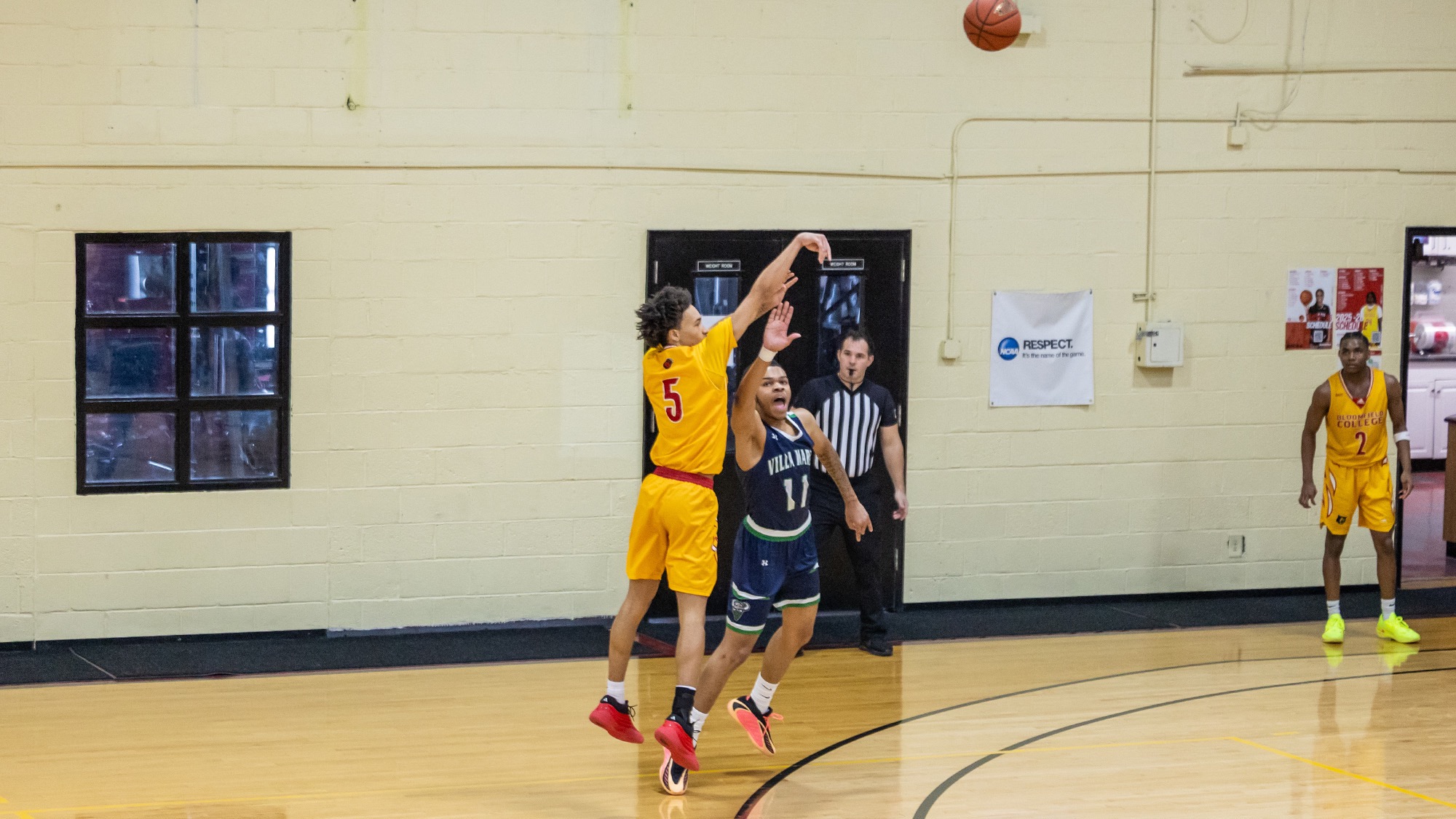 Jayden Bates rises up for a three-pointer against Villa Maria