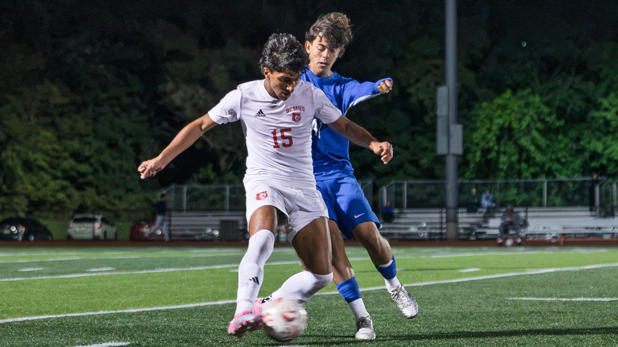 Javien Ruiz of men's soccer holds off a visiting team defender
