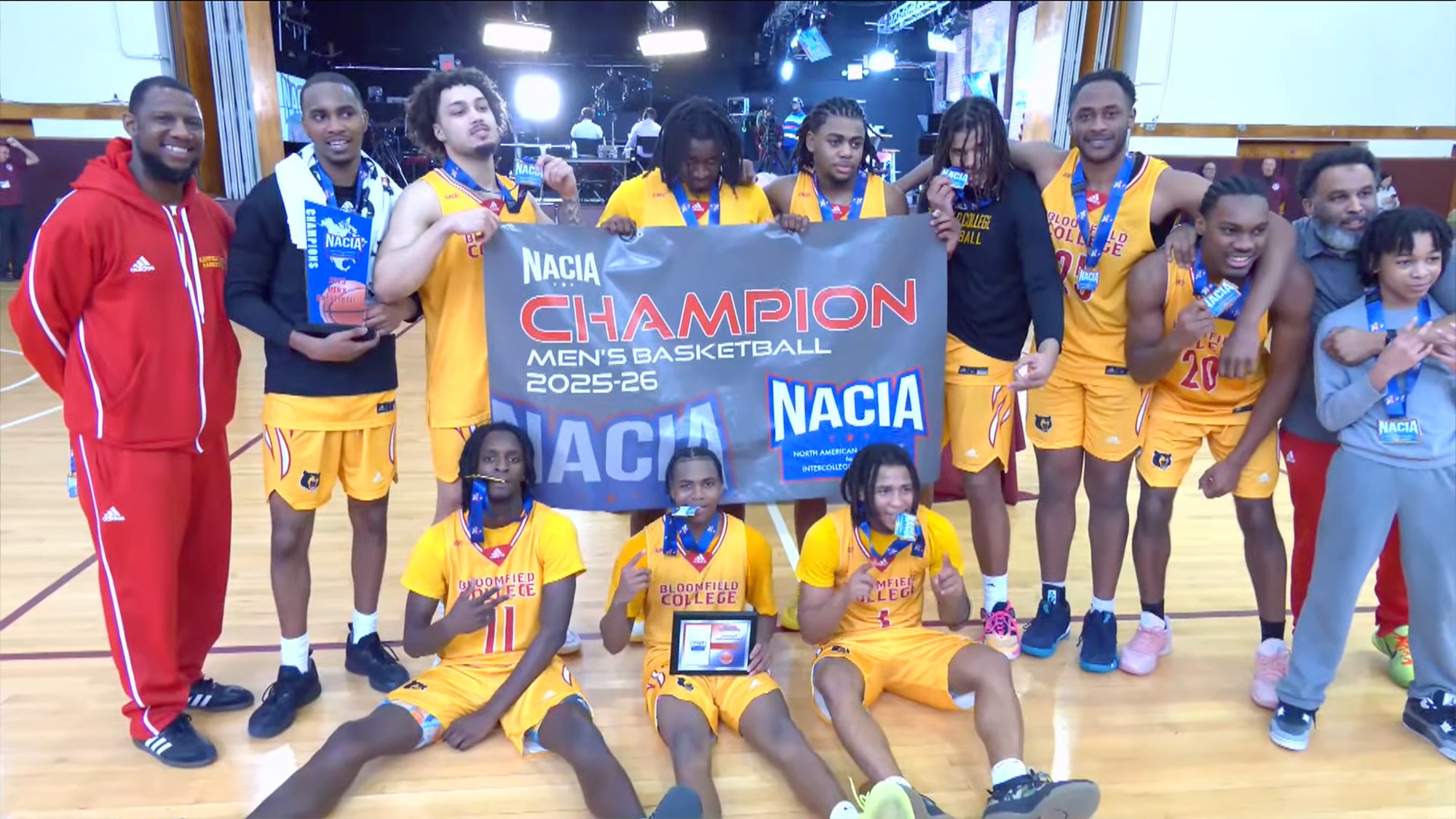 Bears pose for NACIA Championship Banner presentation