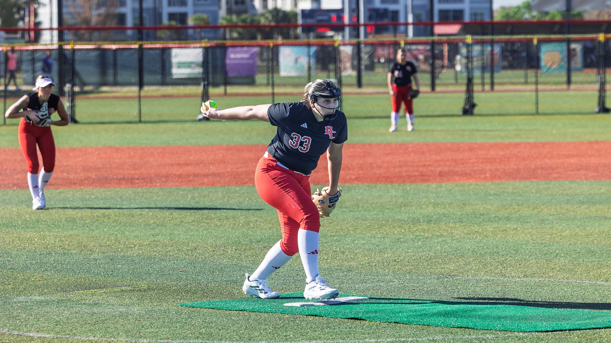 Kate in the circle ready to throw a pitch
