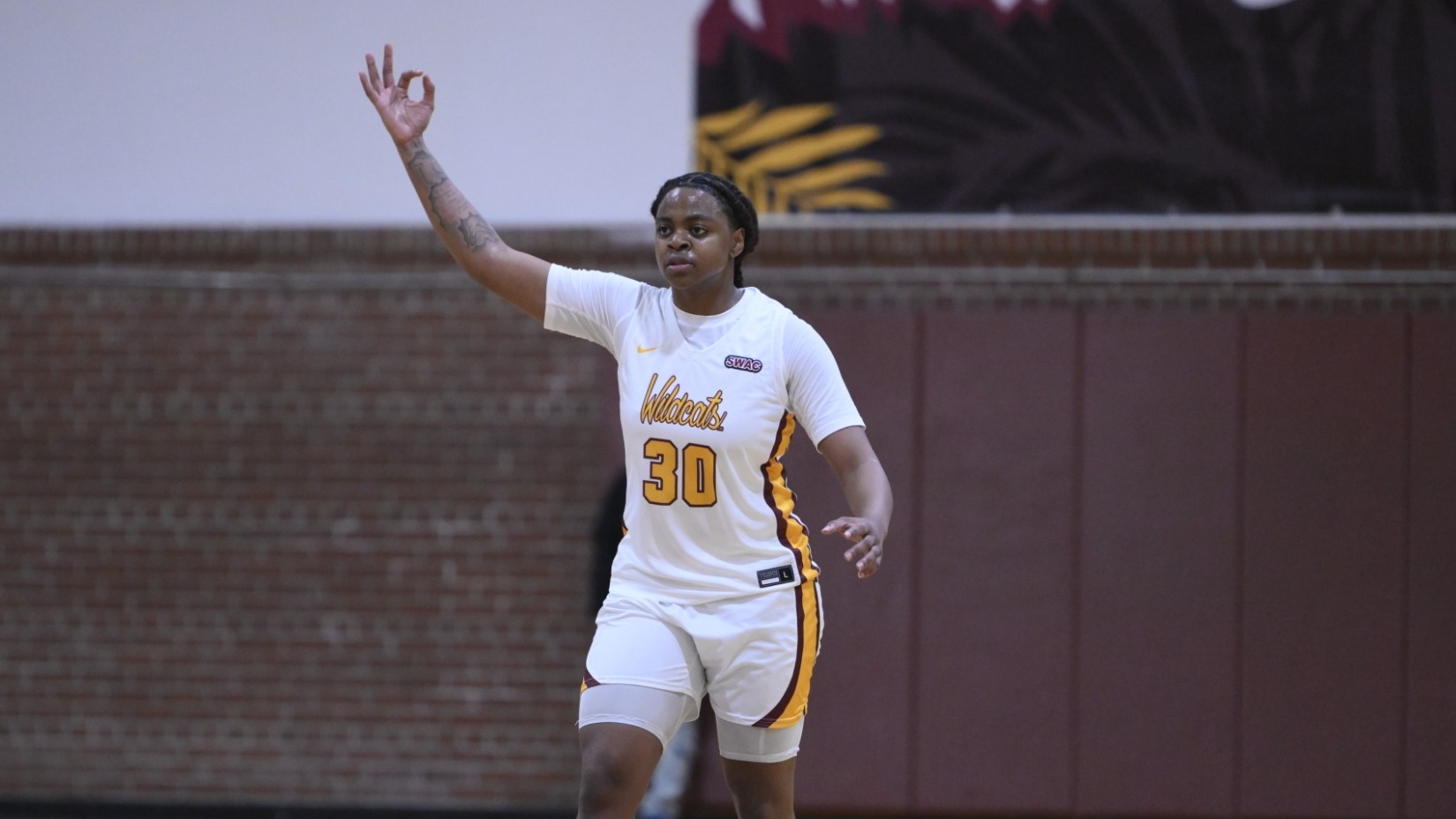 Kailyn Peters celebrates a three at Moore Gym against Texas Southern