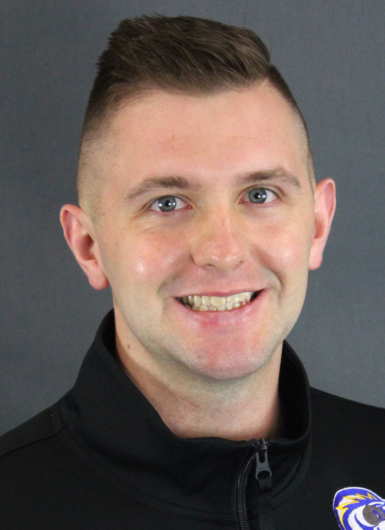 Coach Kyle headshot on gray background