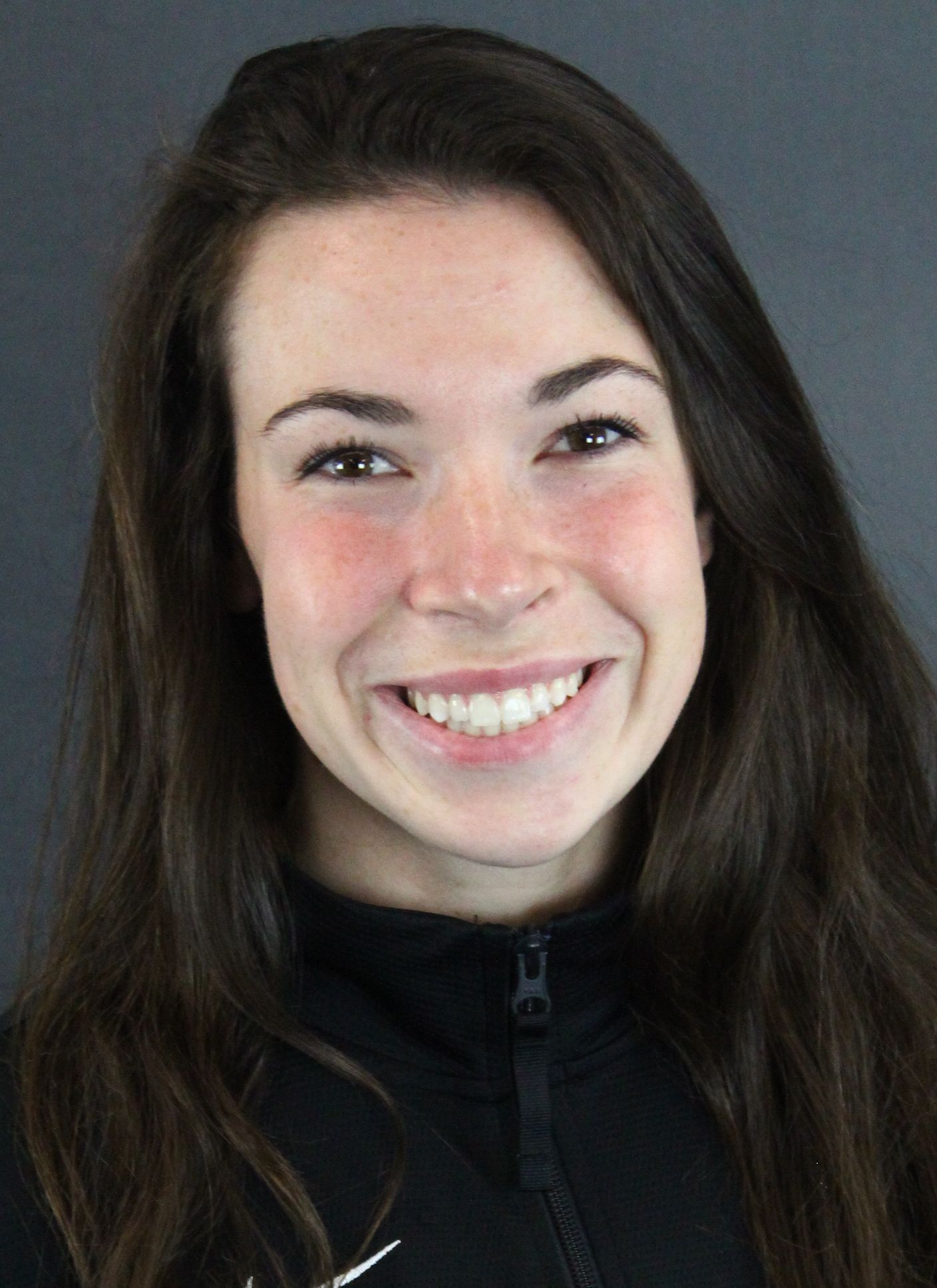 Coach Tramm headshot on gray background