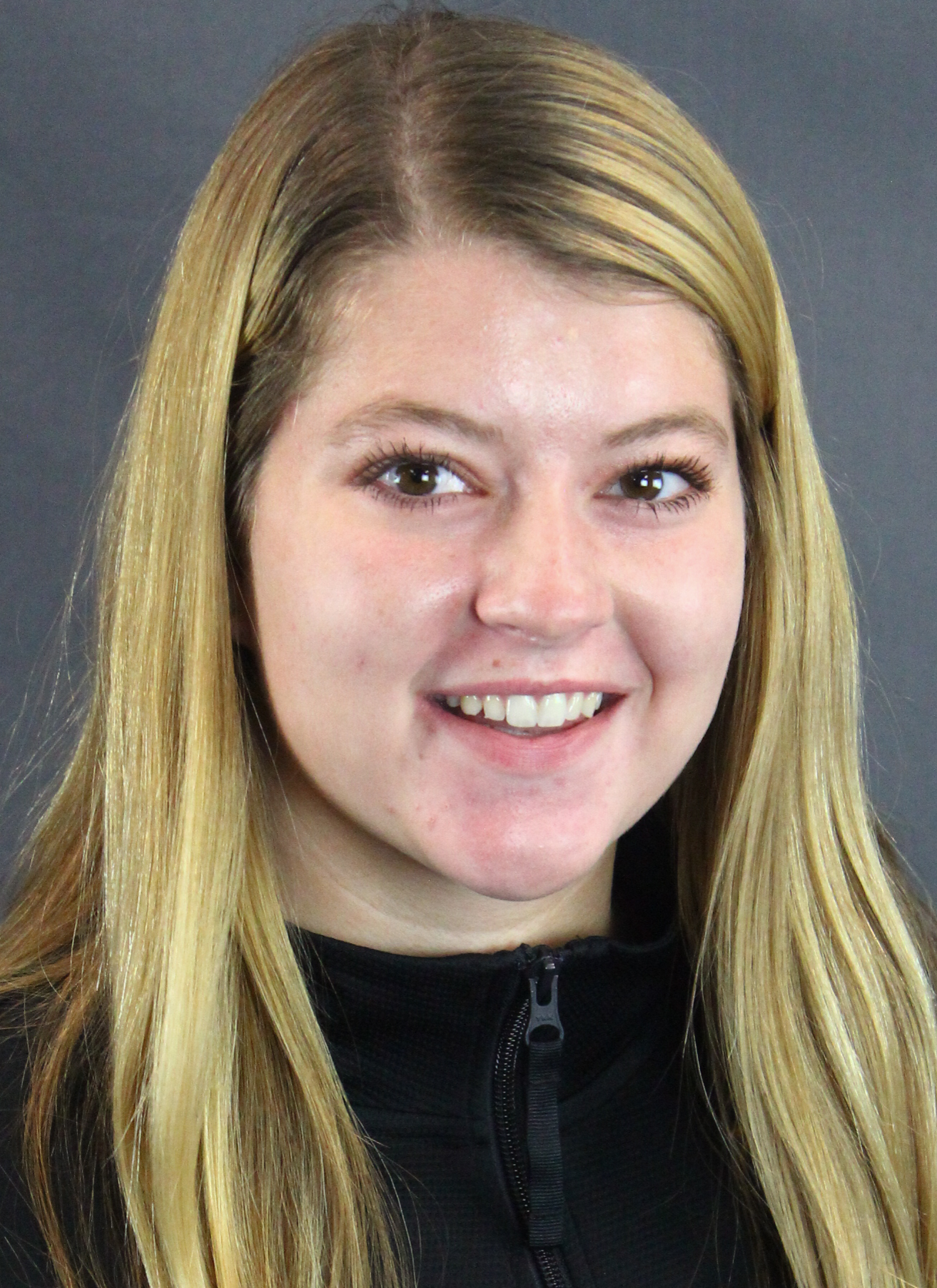 Paige headshot on gray background