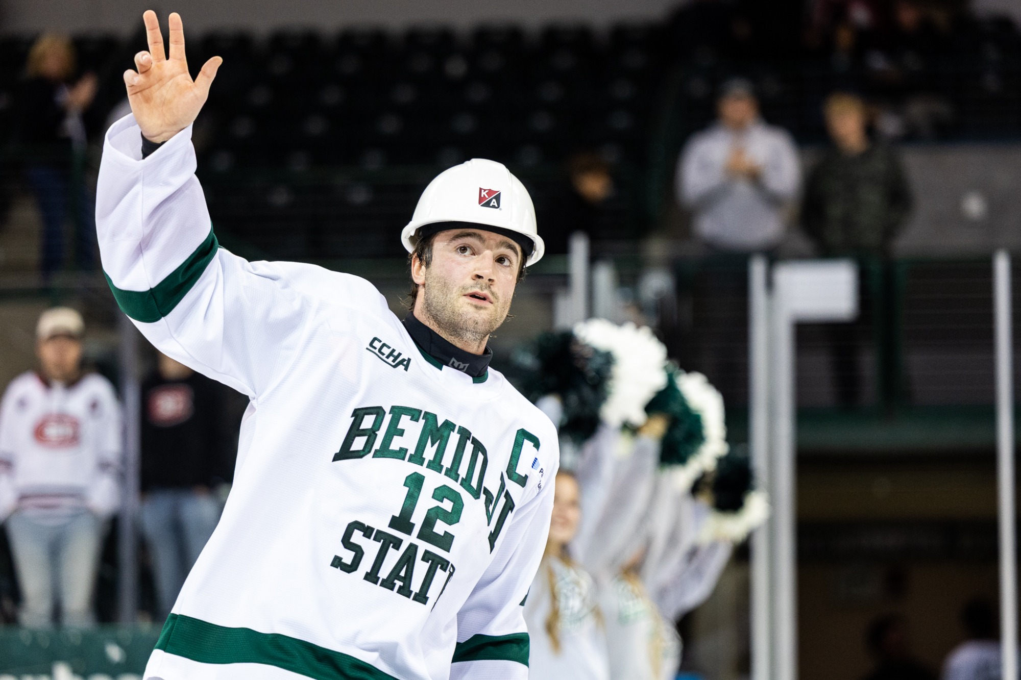 Hudson Thornton waves to the crowd during a postgame hard hat recognition ceremony.