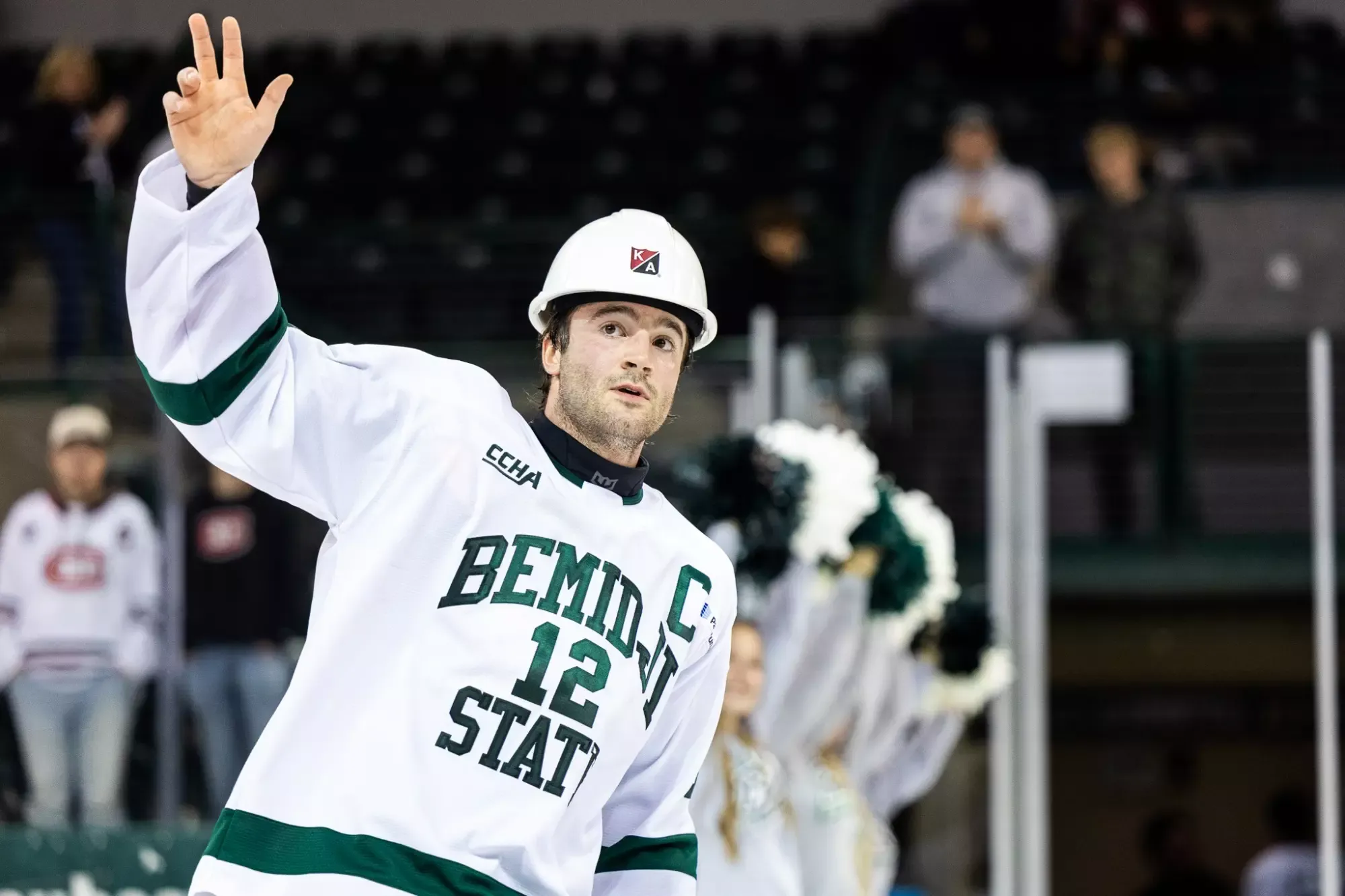 Hudson Thornton waves to the crowd during a postgame hard hat recognition ceremony.