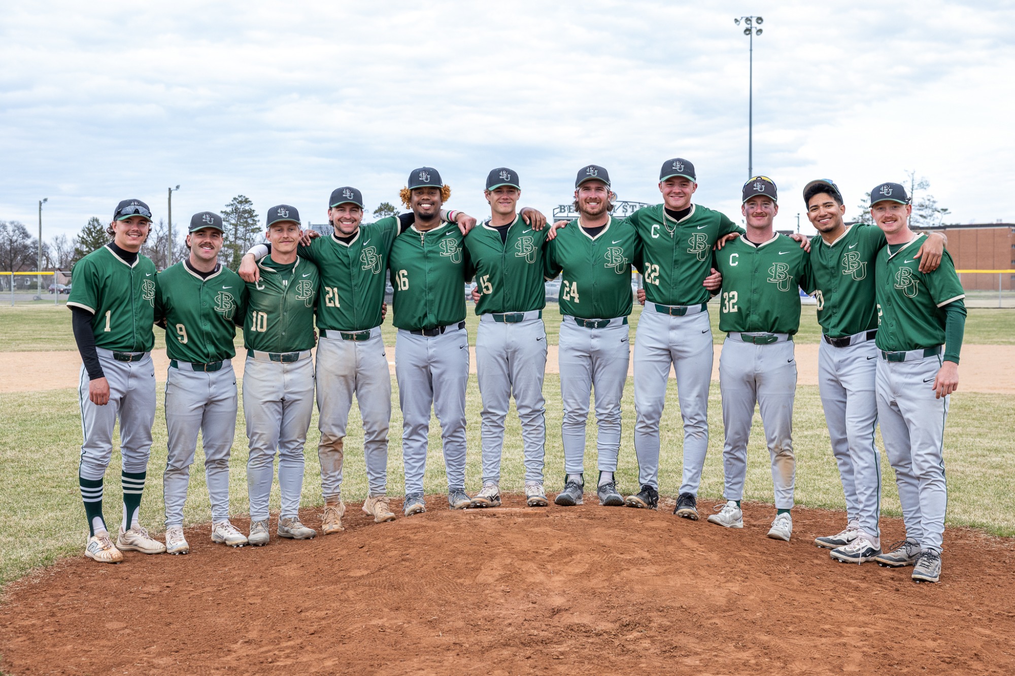 Beau Barry (1), Nick Ekstrum (9), Noah Drusch (10), Chris Koscielniak (21), Marcus Haire (16), Cole Smith (15), Devon Cook (24), Jack Barnett (22), Hunter Hyden (32), Adrian Falcon (30), Riley Czech (12) - BB Bemidji State vs. Minot State - BSU Baseball Field - Bemidji, MN - Sunday, April 26, 2026 | Brent Cizek