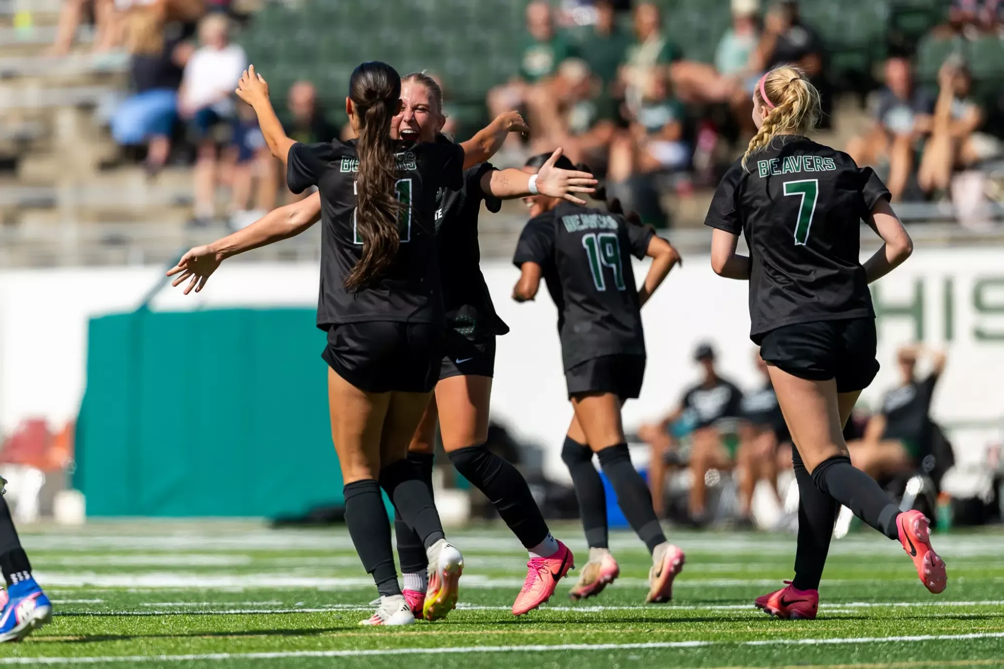 Bemidji State players gather near midfield after a scoring play.