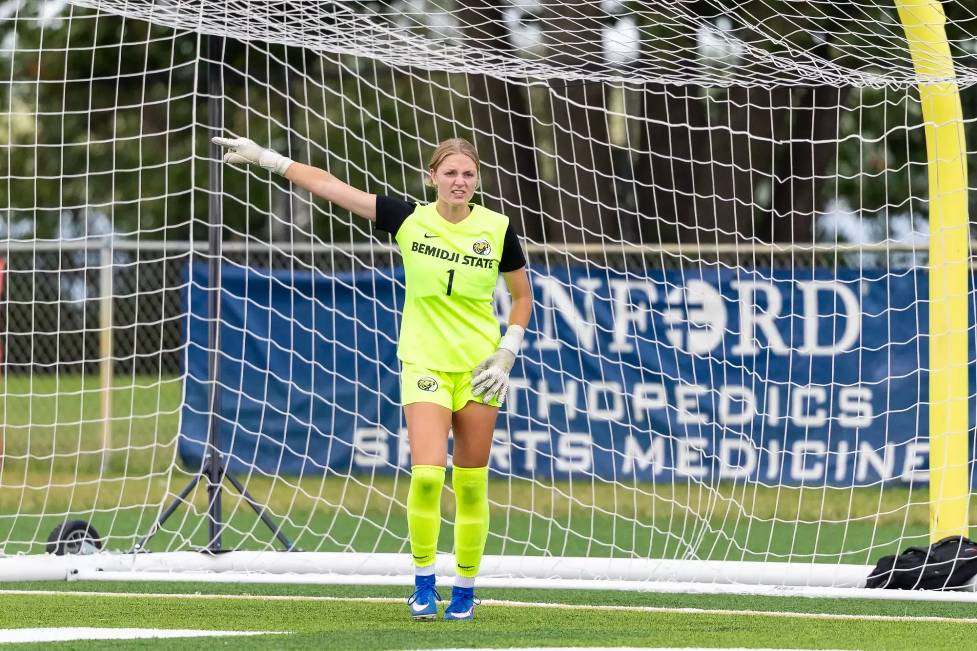 A Bemidji State goalkeeper points across the field while organizing the defense.