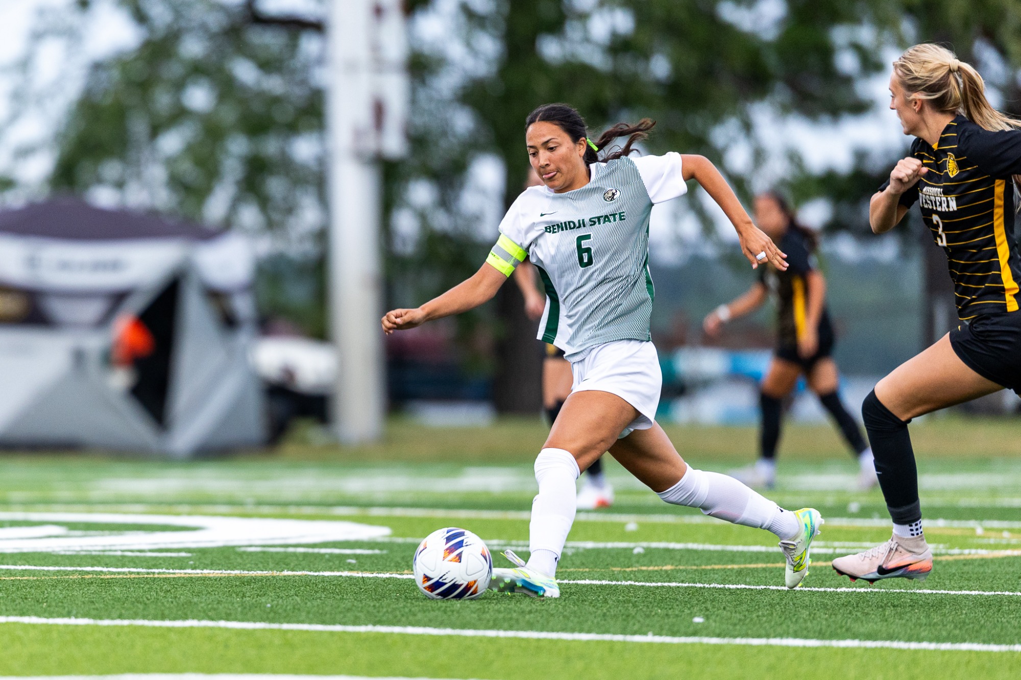 Megan Ko advances the ball against a Missouri Western defender.