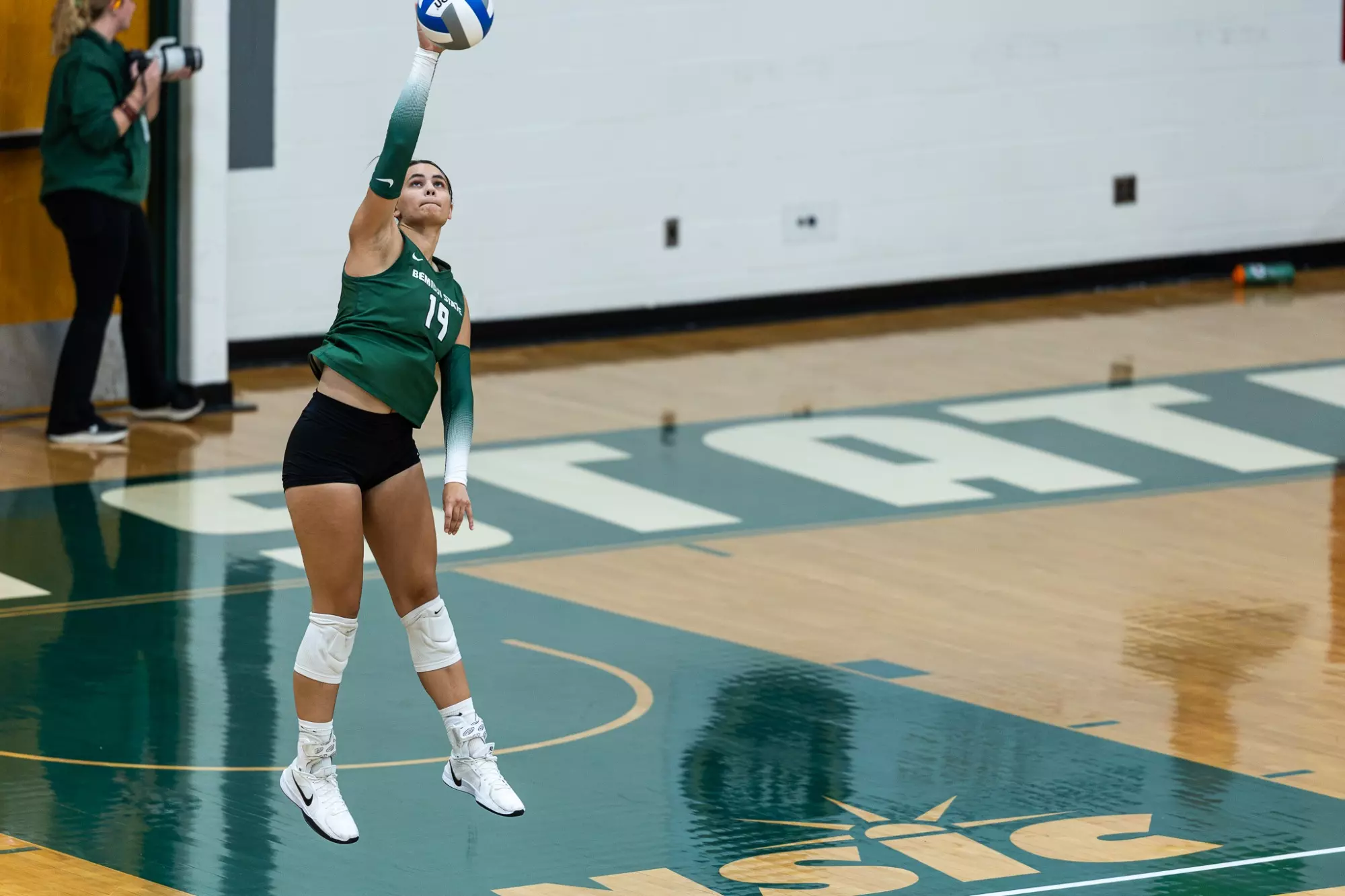 Isabella Vander Velden (19) jump serves against Minnesota Duluth.