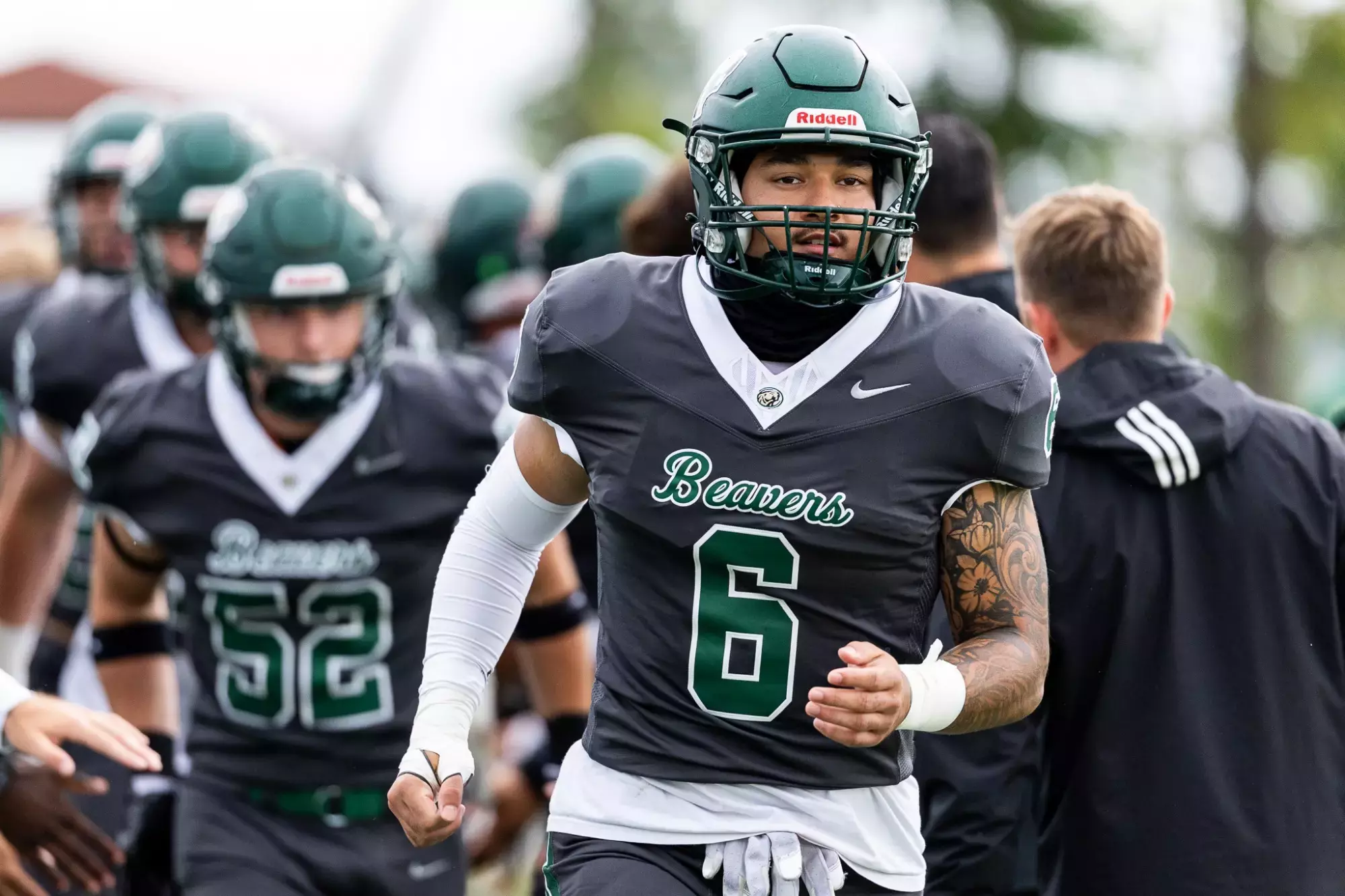 Bemidji State player No. 6 walks past teammates during pregame warmups.