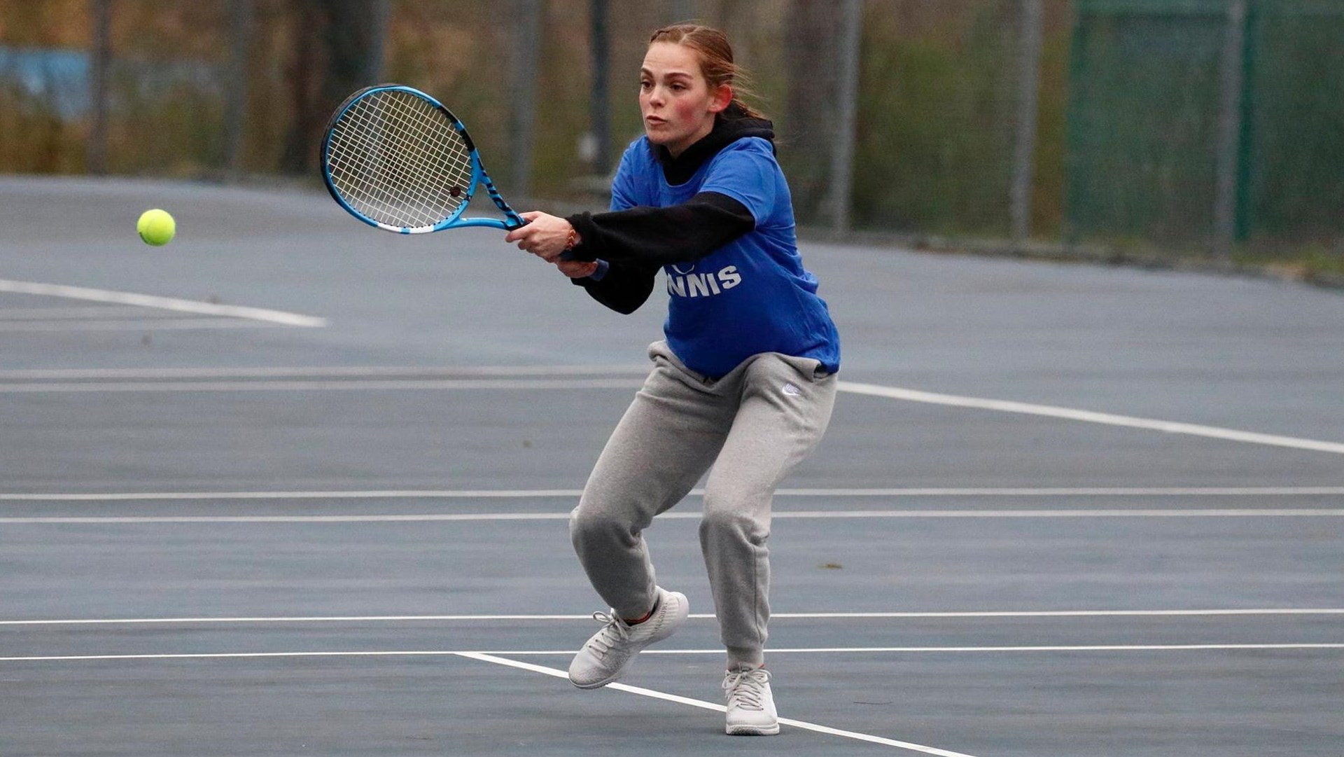 Women's Tennis Player Serving