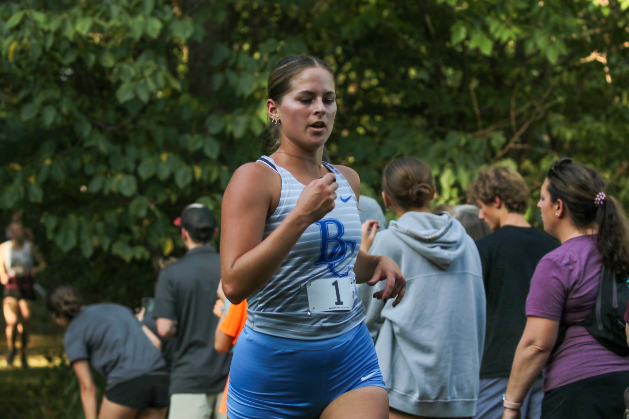 Carah running in forest 