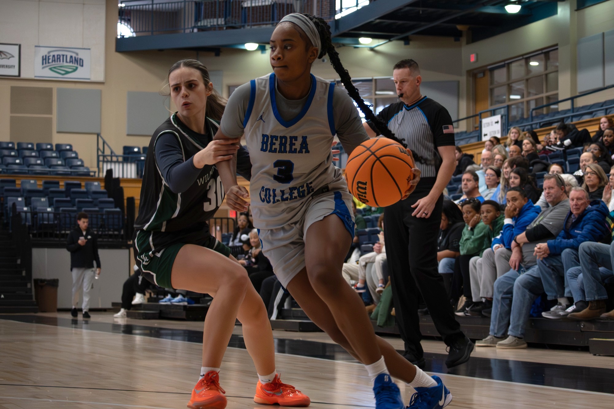 Atiya Moss runs past defender