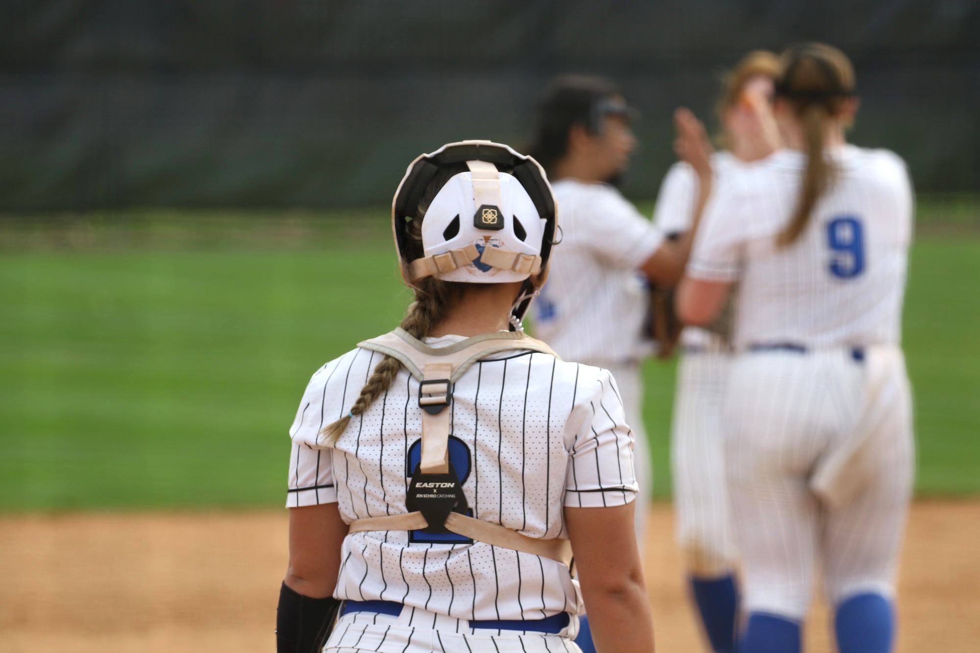 Josie looks at Team huddle