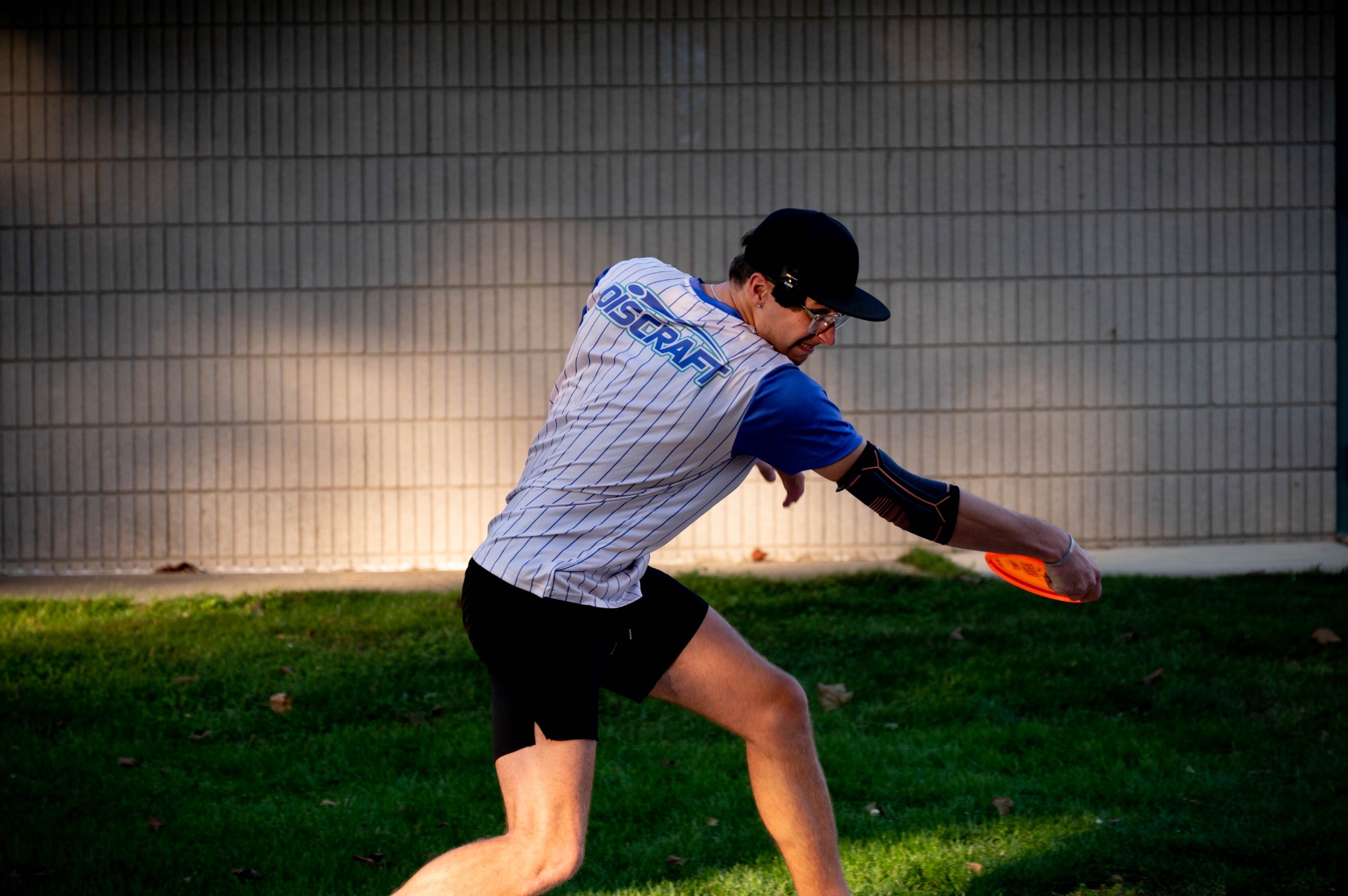 A member of the Club Disk Golf team prepares to throw a long drive down the course.