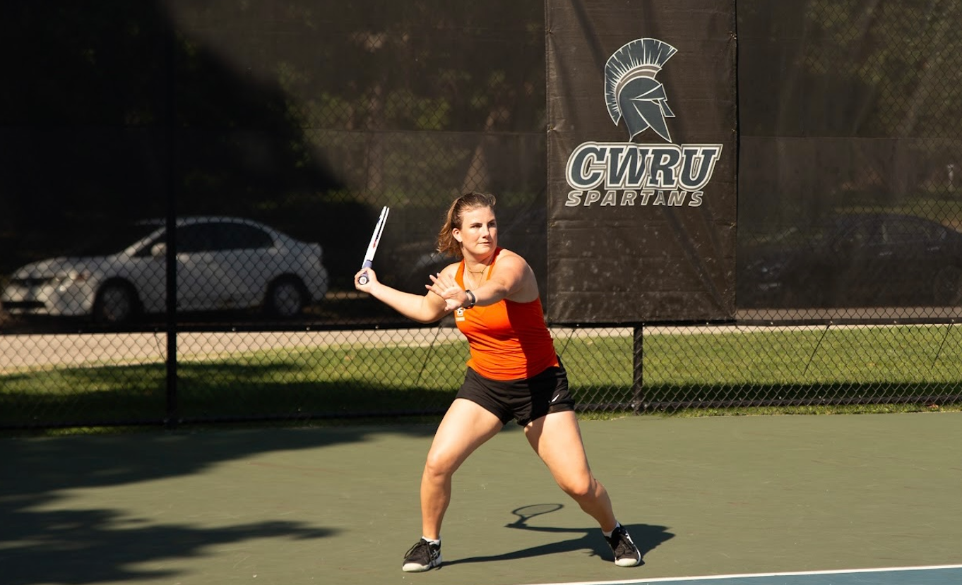 Tennis player swinging racquet during match at the Cleveland Classic tournament
