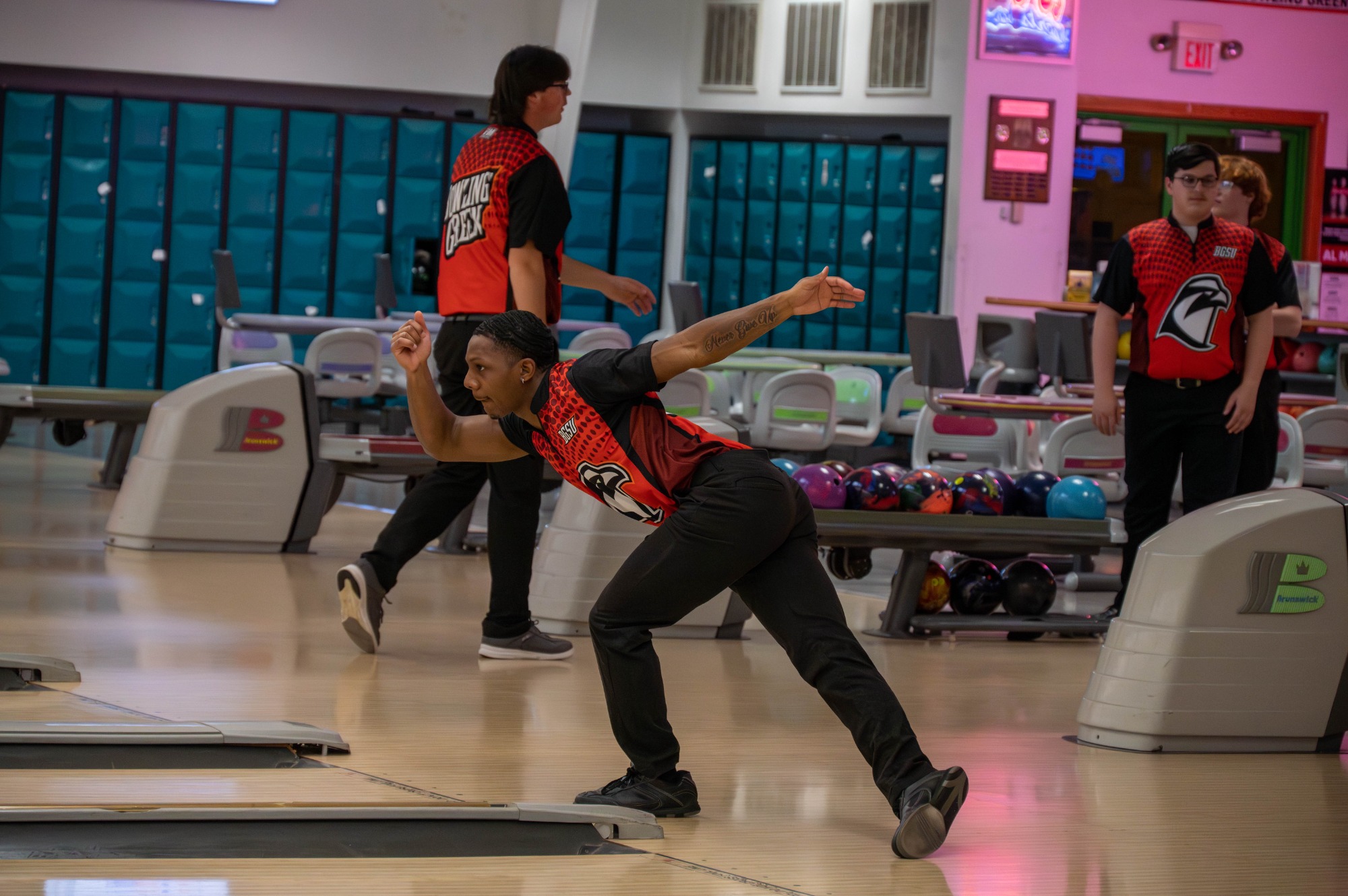 Member of the Men's Club Bowling team after throwing his ball down the lane.