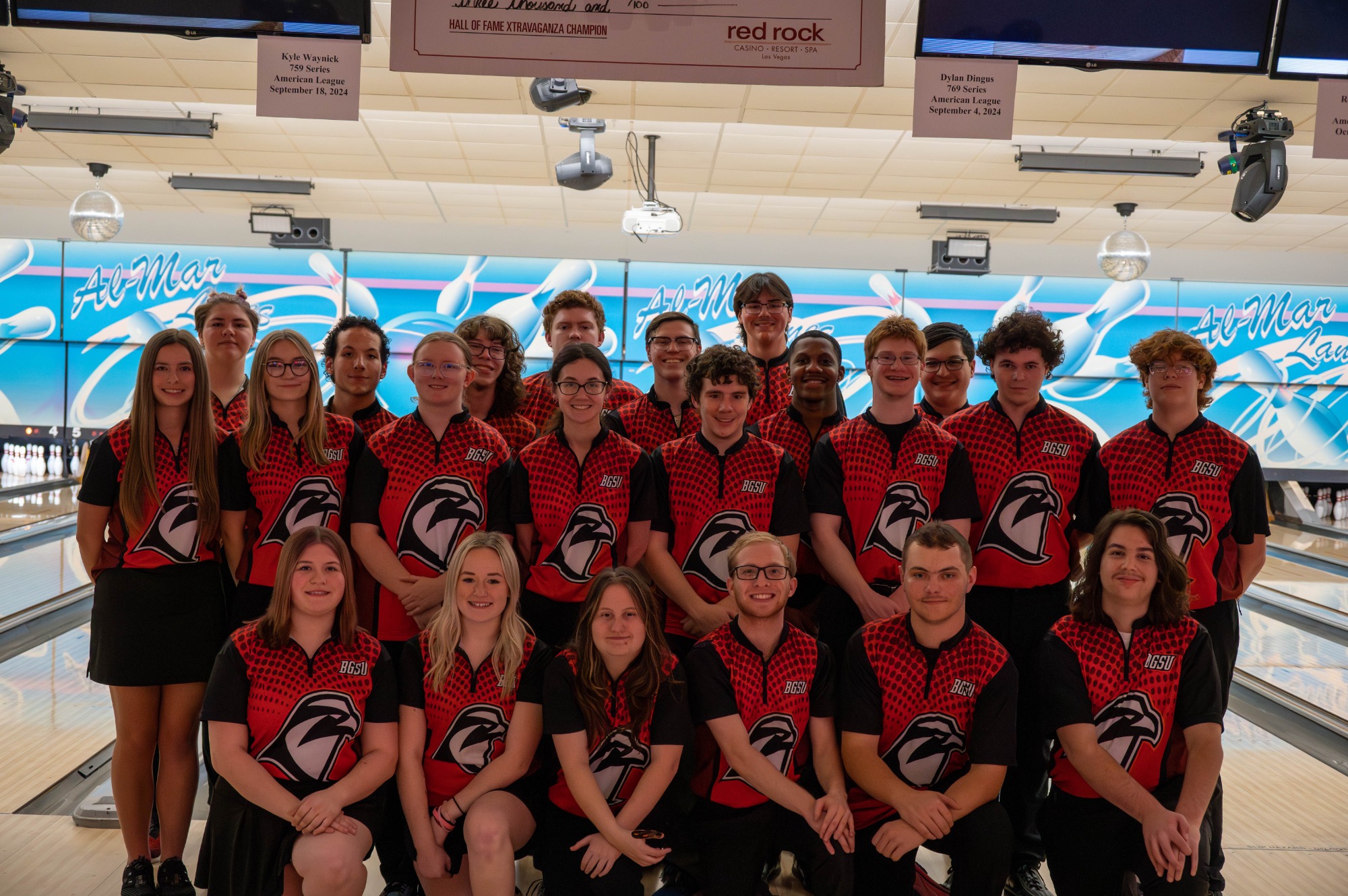 The Men's and Women's Club Bowling teams smile for a picture together. 