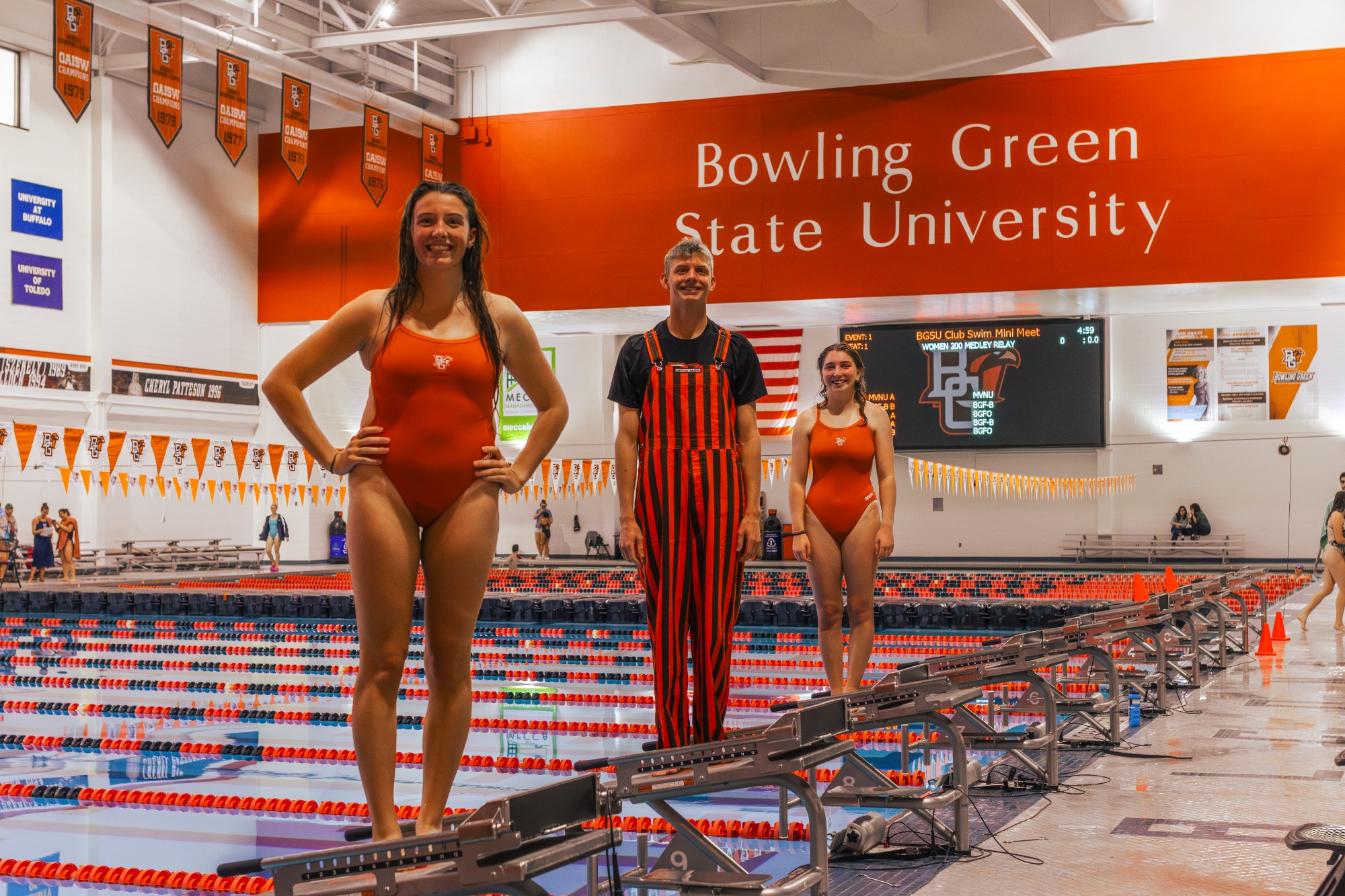 Seniors standing on swim blocks