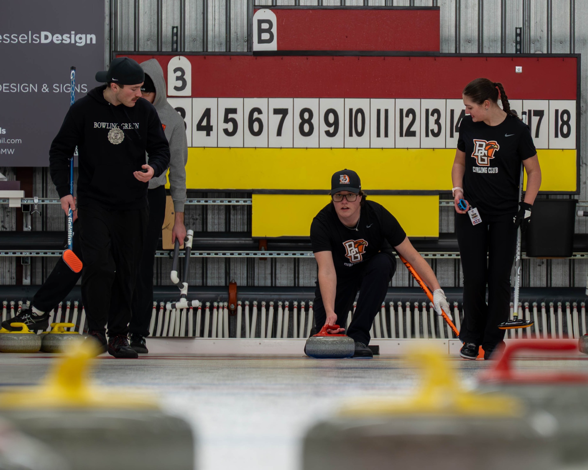 Player throwing curling rock.