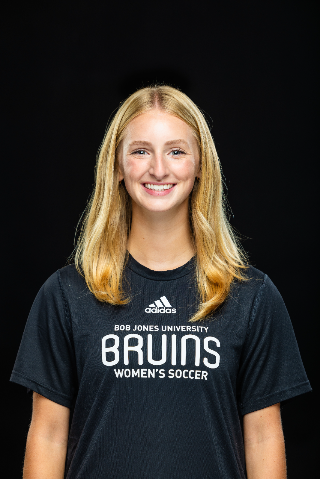 A member of the BJU Bruins roster poses for a headshot on a black background at Bob Jones University in Greenville, S.C., Monday, Aug. 18, 2025. (Photo by Derek Eckenroth)