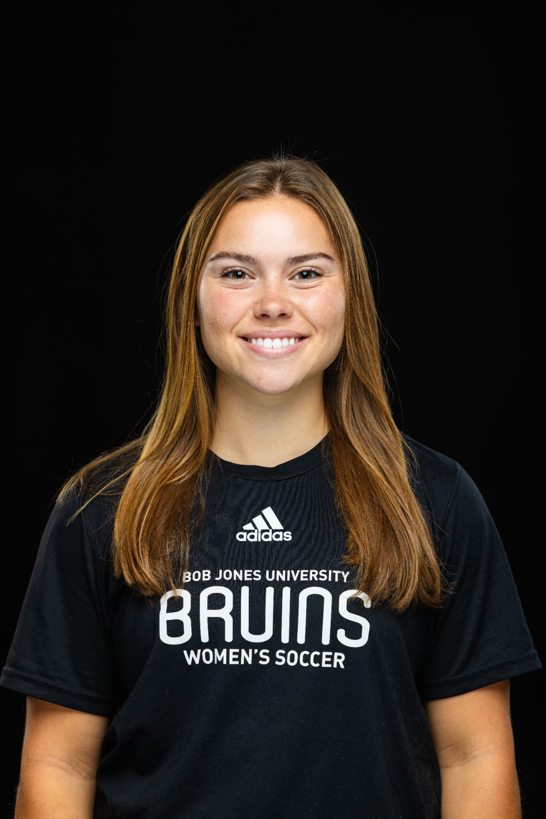 A member of the BJU Bruins roster poses for a headshot on a black background at Bob Jones University in Greenville, S.C., Monday, Aug. 18, 2025. (Photo by Derek Eckenroth)