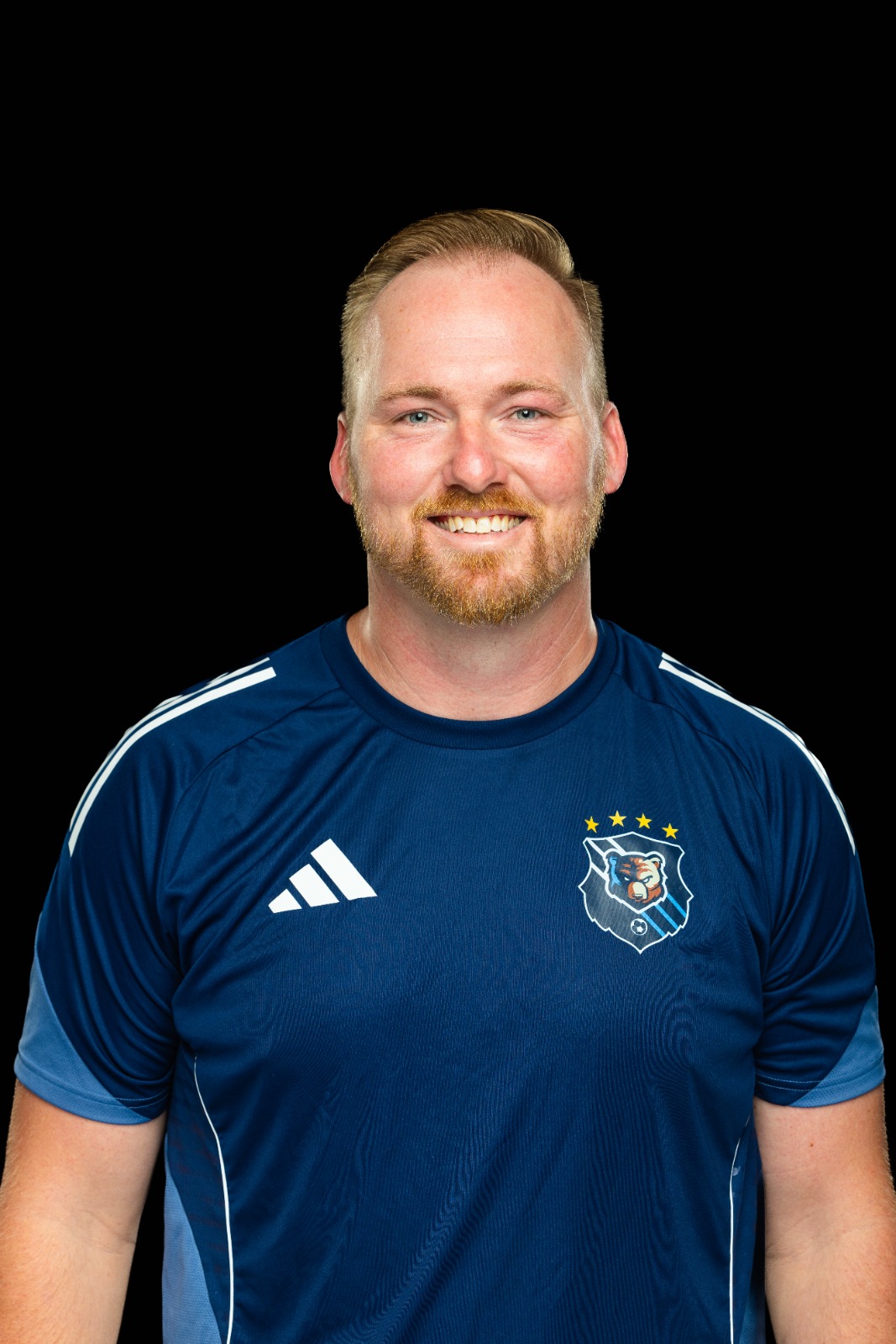 A member of the BJU Bruins roster poses for a headshot on a black background at Bob Jones University in Greenville, S.C., Monday, Aug. 18, 2025. (Photo by Derek Eckenroth)