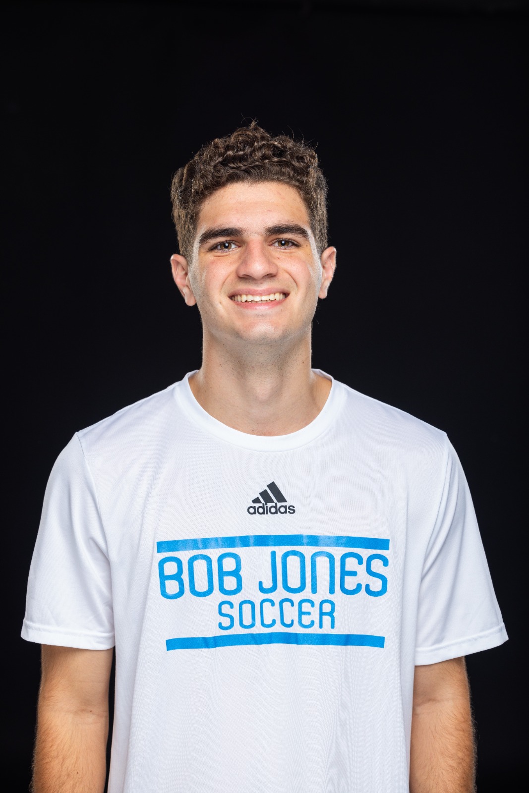 A member of the BJU Bruins roster poses for a headshot on a black background at Bob Jones University in Greenville, S.C., Monday, Aug. 18, 2025. (Photo by Derek Eckenroth)