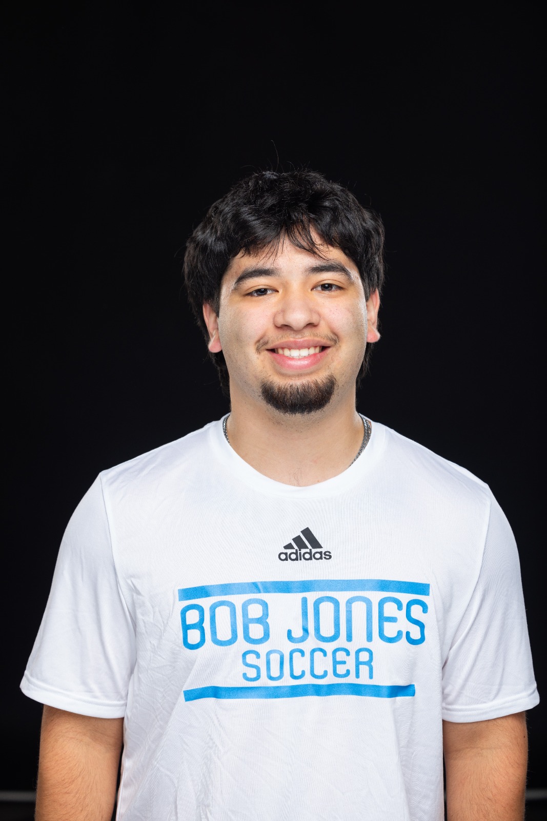 A member of the BJU Bruins roster poses for a headshot on a black background at Bob Jones University in Greenville, S.C., Monday, Aug. 18, 2025. (Photo by Derek Eckenroth)