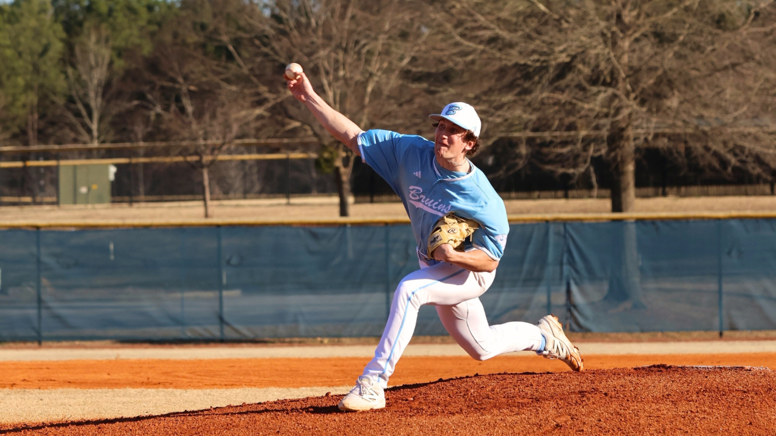 Bruins baseball pitcher winding up for a pitch on the mound