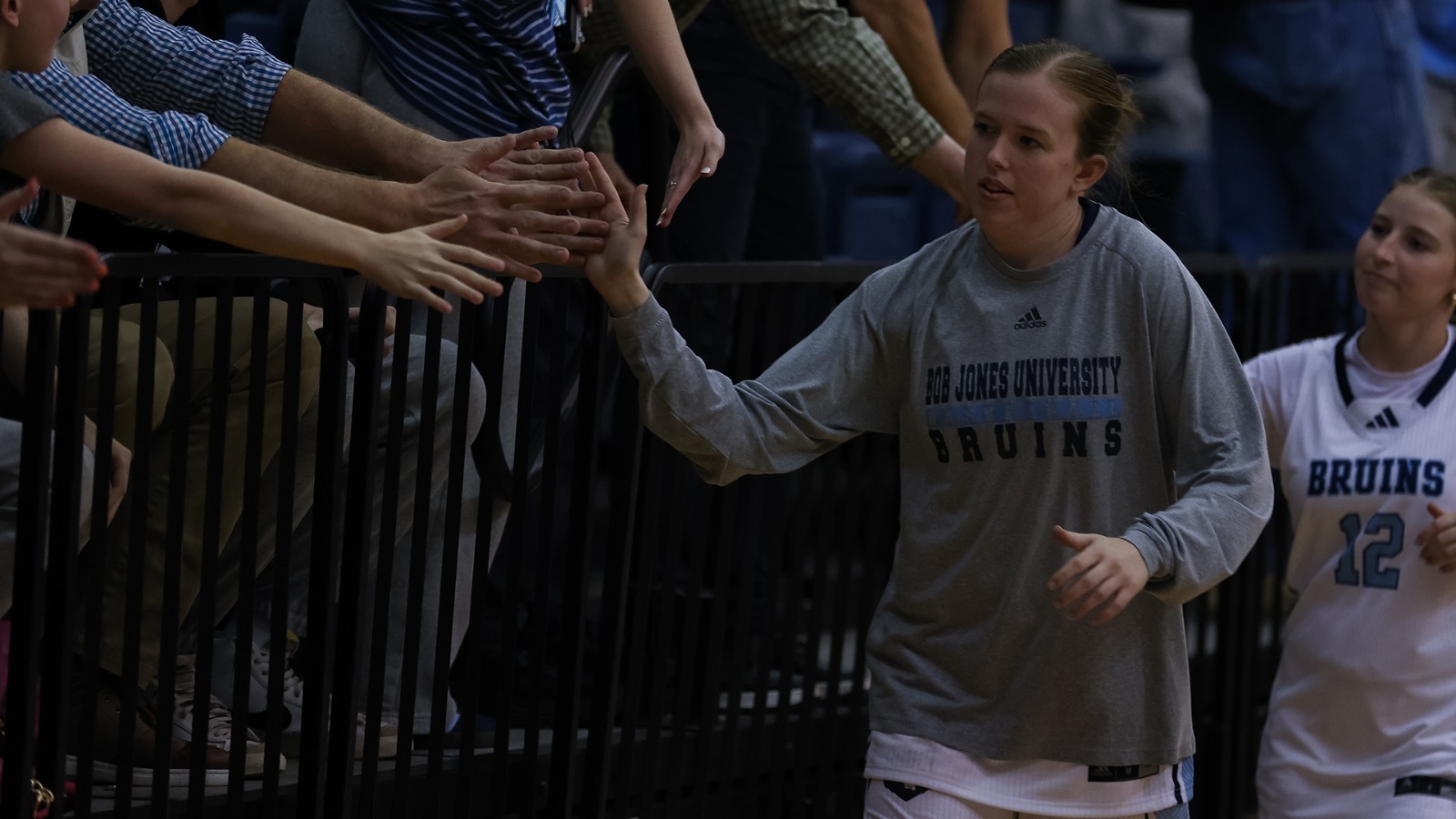 Shelby Epperson high fiving fans