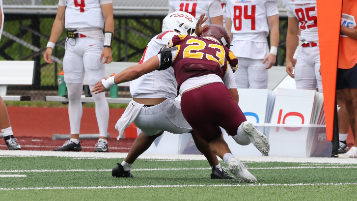 Garrett Garcia tackles an Edinboro player