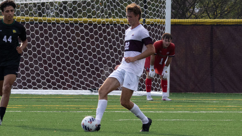 Andrew Beagle plays a ball past a defender