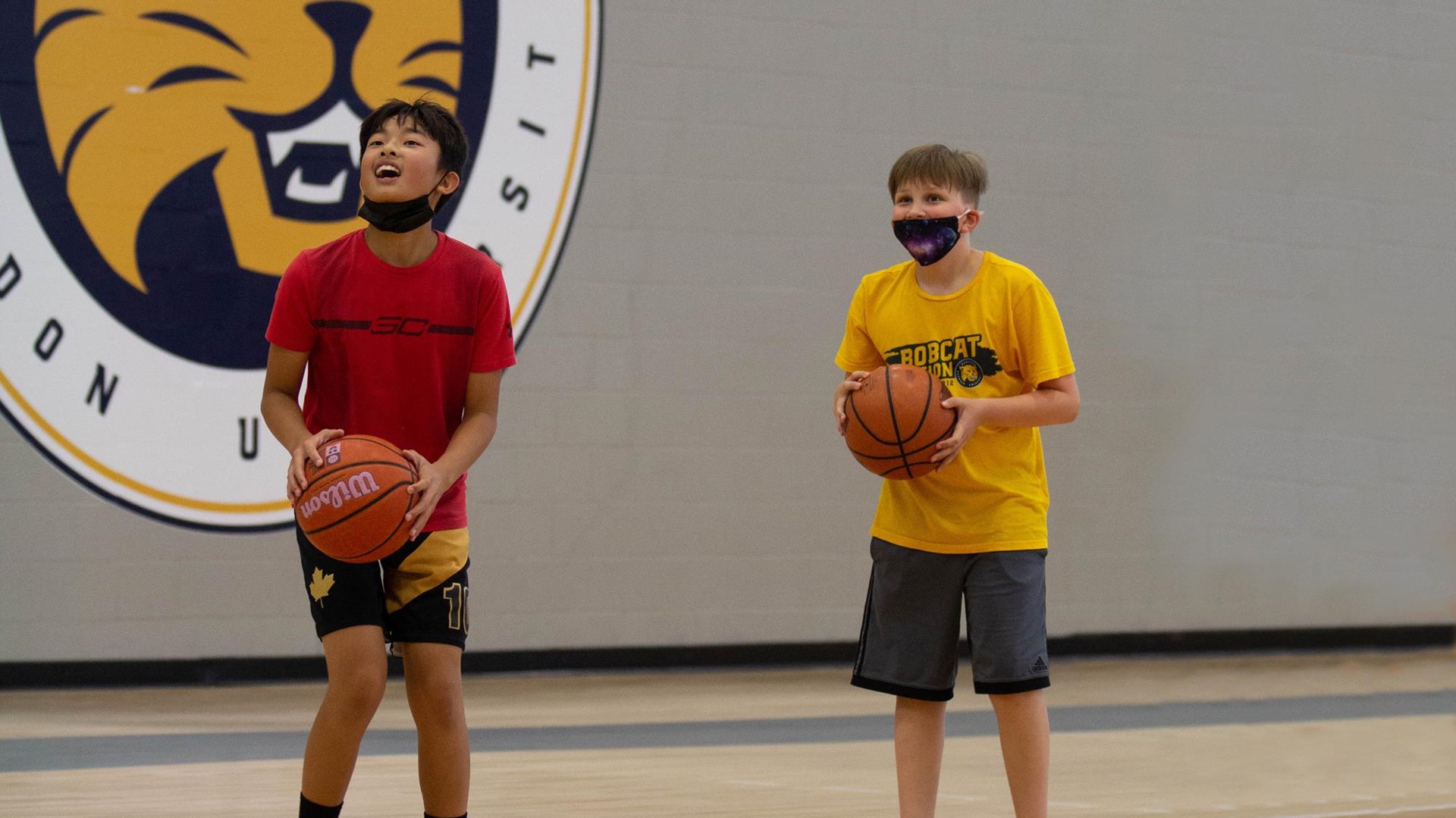 Participants eye up a shot in Bobcat summer camp