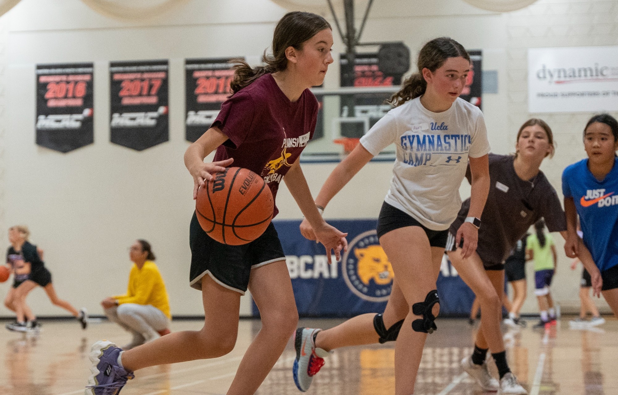 Basketball Camp participants compete one-on-one