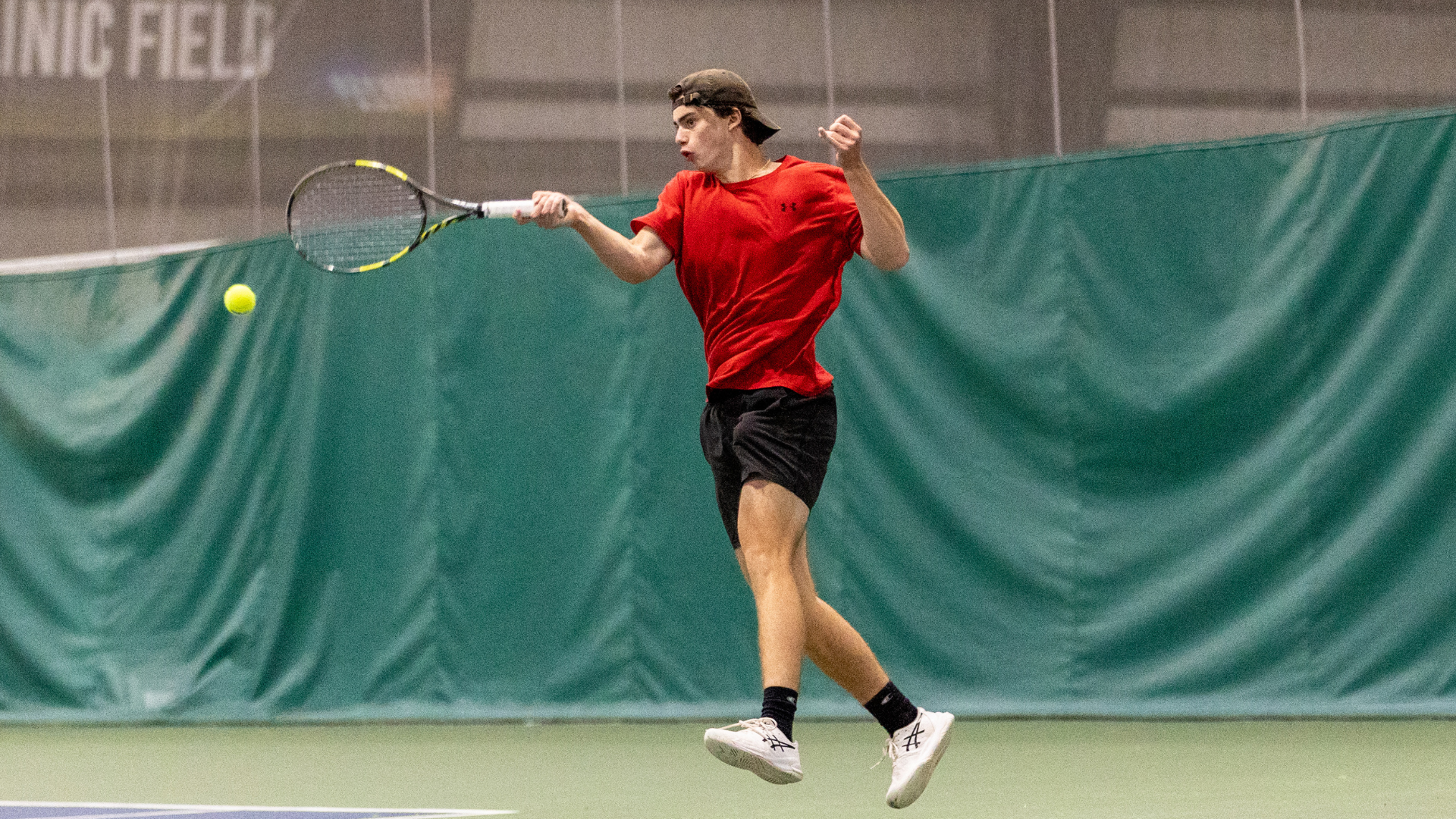 Alex Williams returning a serve.