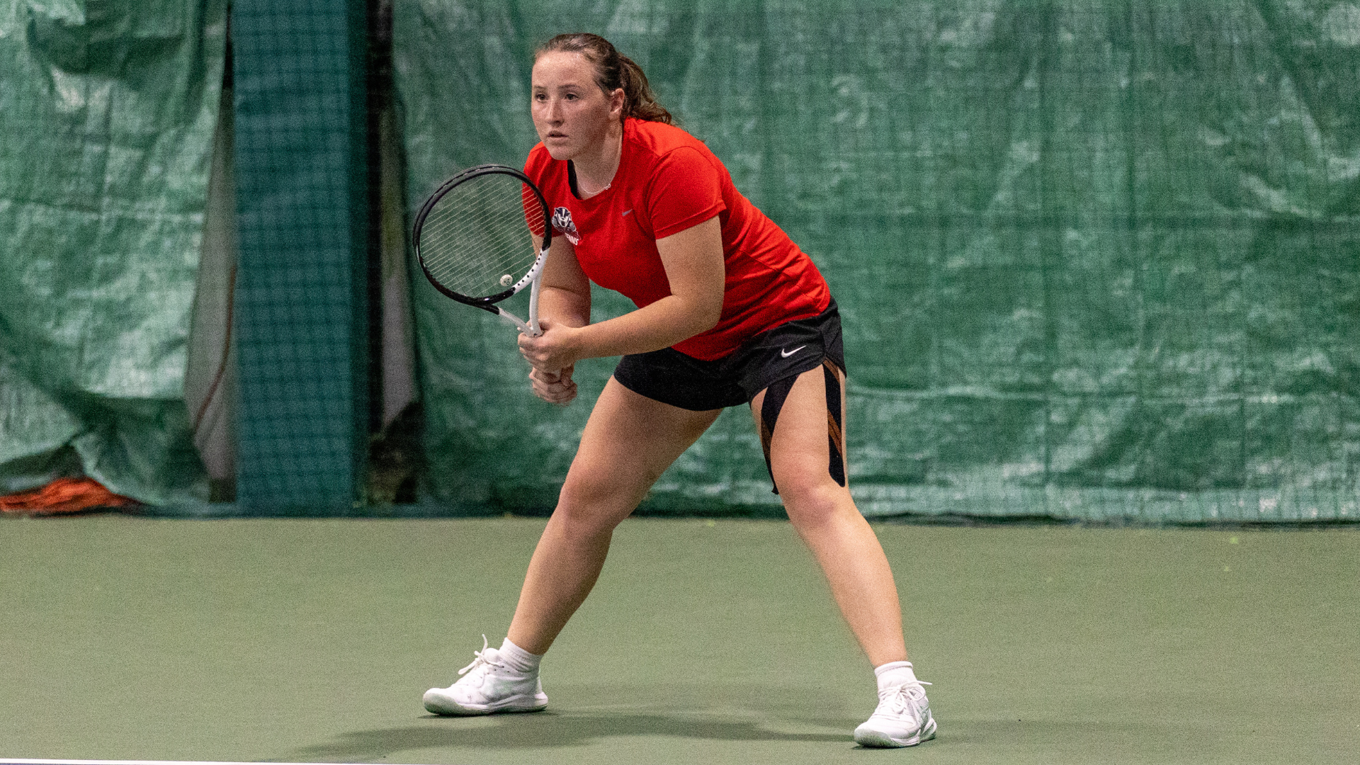 Cynthia Szebeni preparing to return a serve