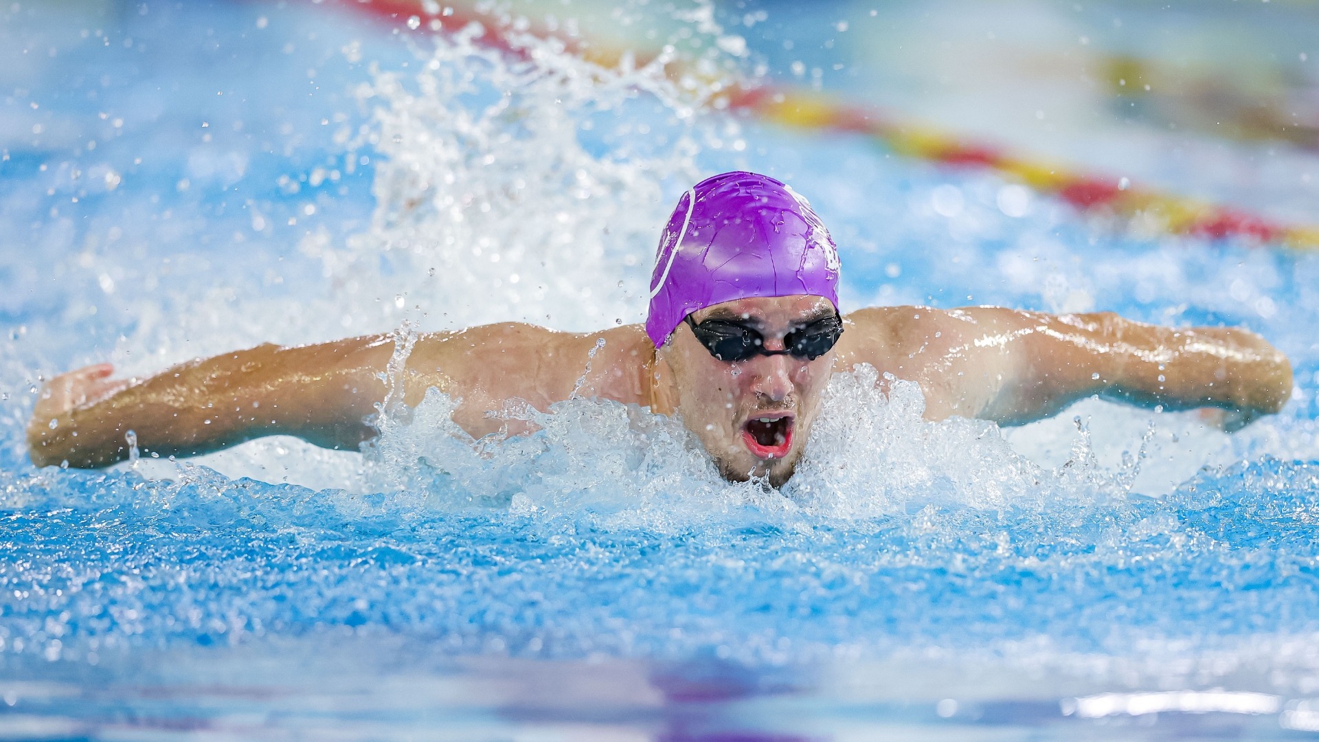 Evan Karlov swimming at the OUA Sprint Invitational