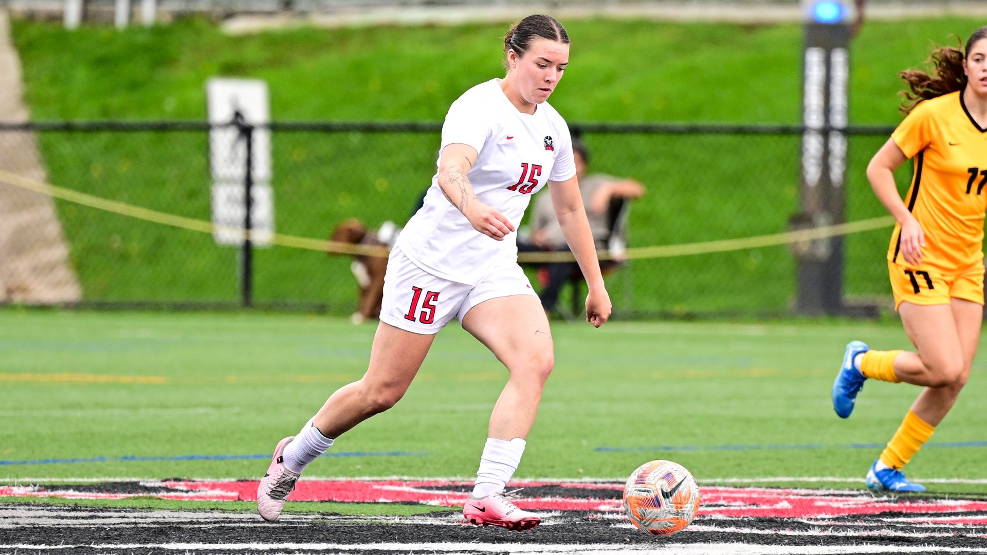 Stefanie Young moving up field with the ball
