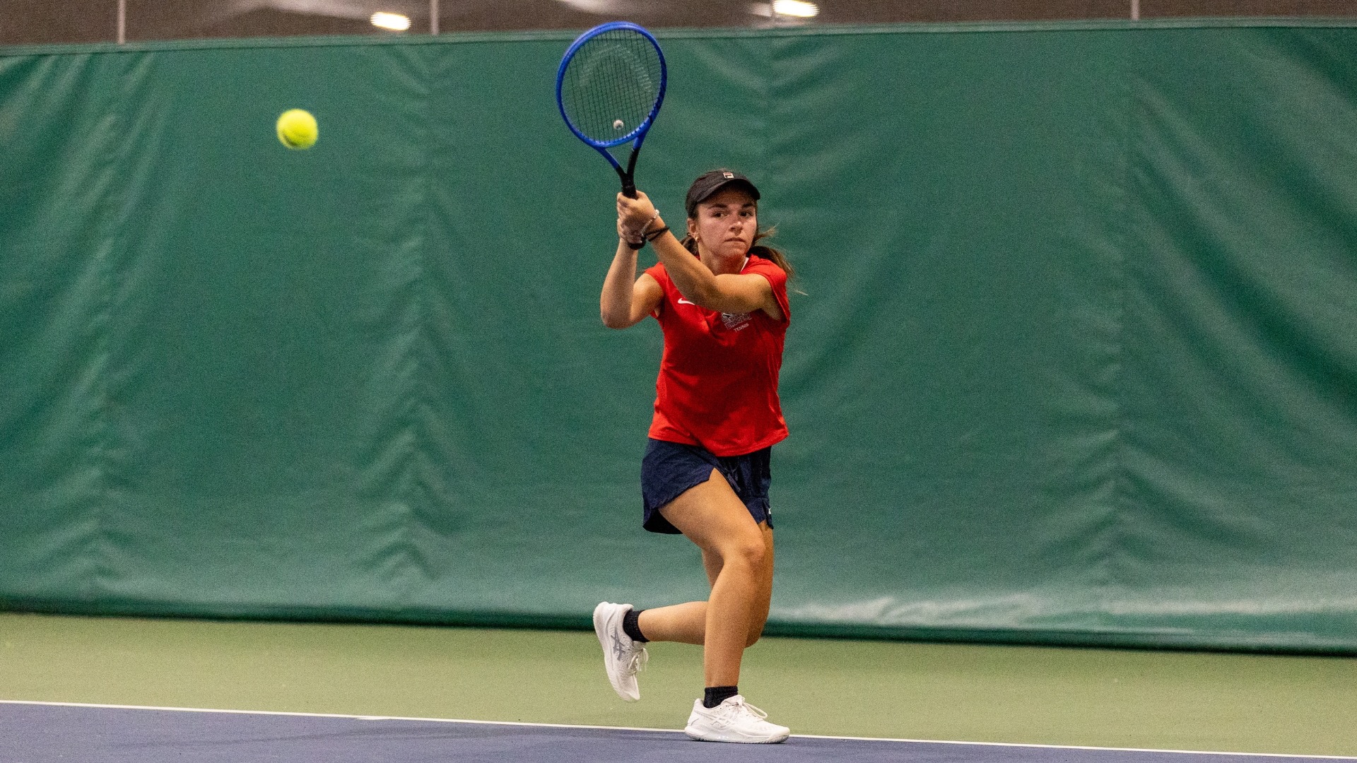 Aleks Paramentic hitting a backhand