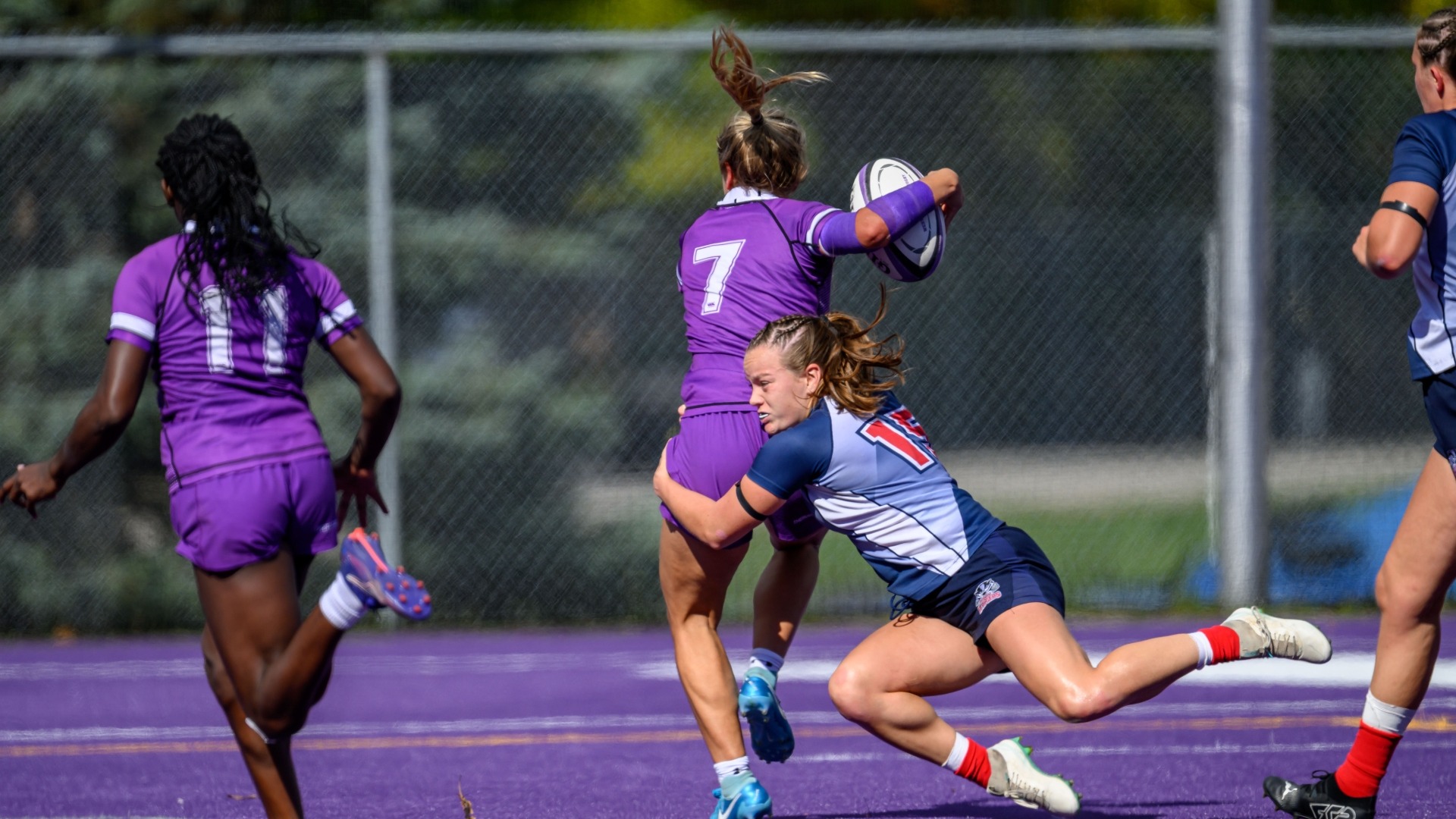 Mya Rickerby, pictured on the right, making a tackle against the Western Mustangs