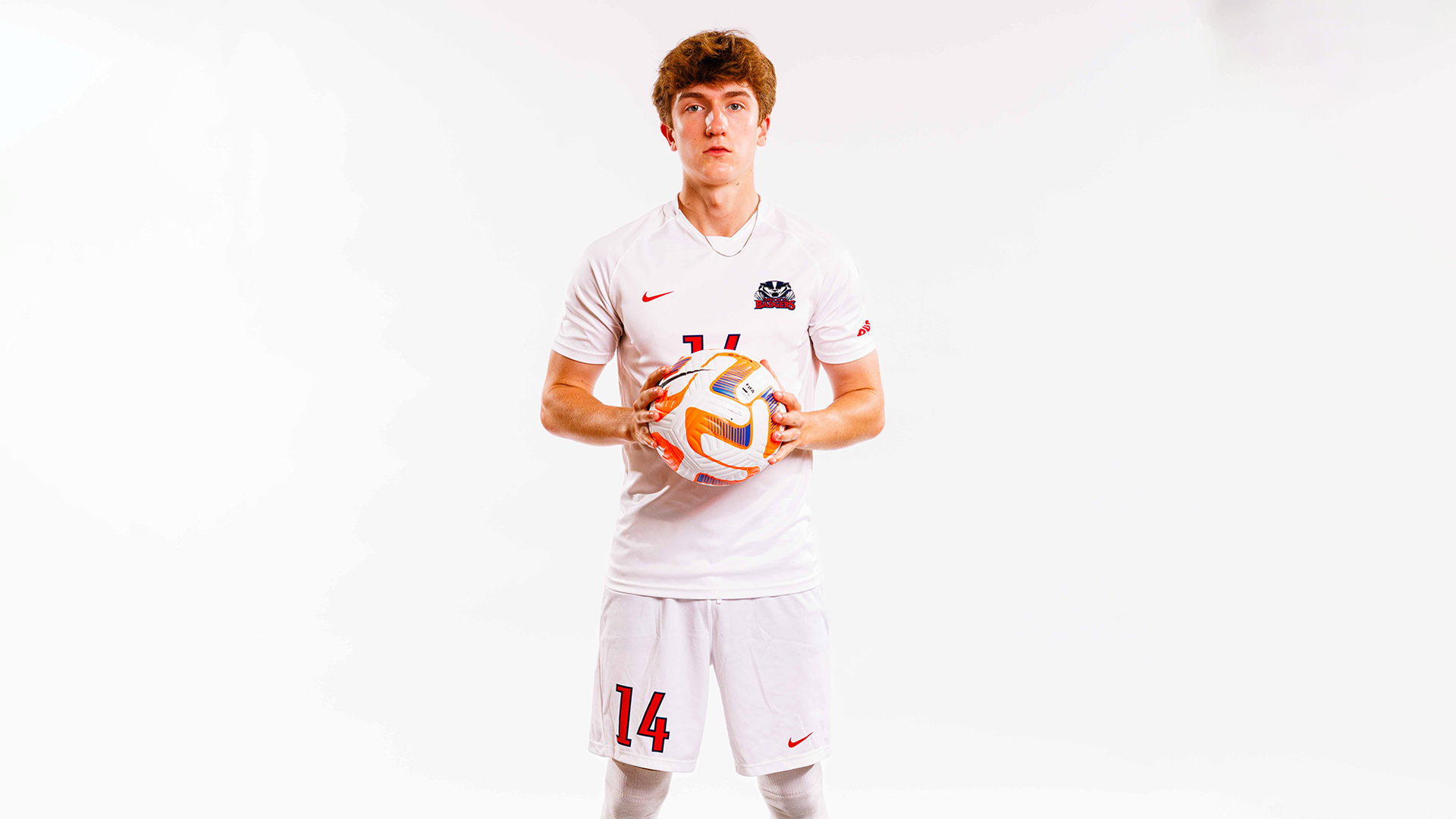 Gabriel Tardif pictured holding a soccer ball in a media day photo