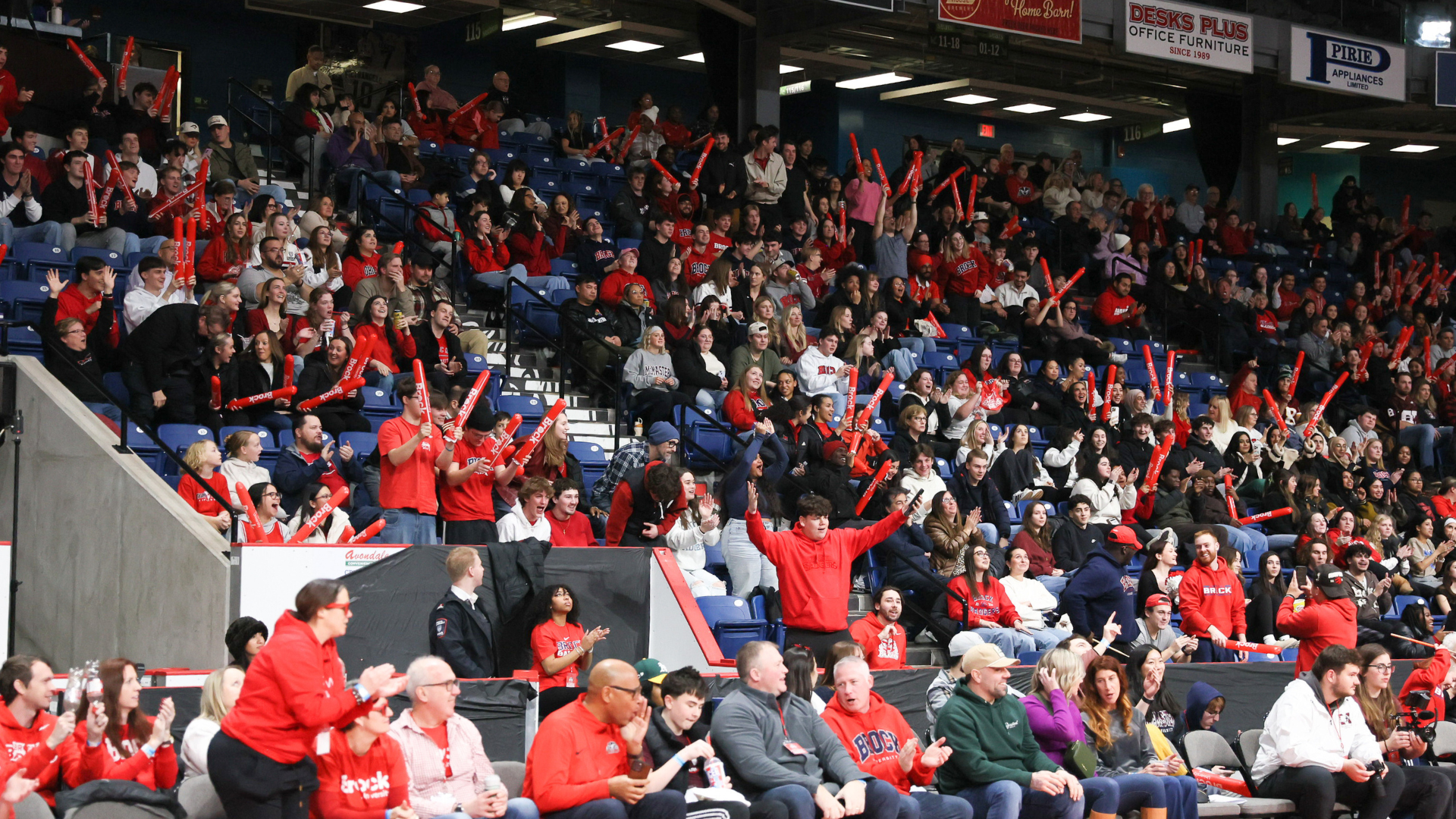 A crowd celebrating at the Paint the Meridian Red game.