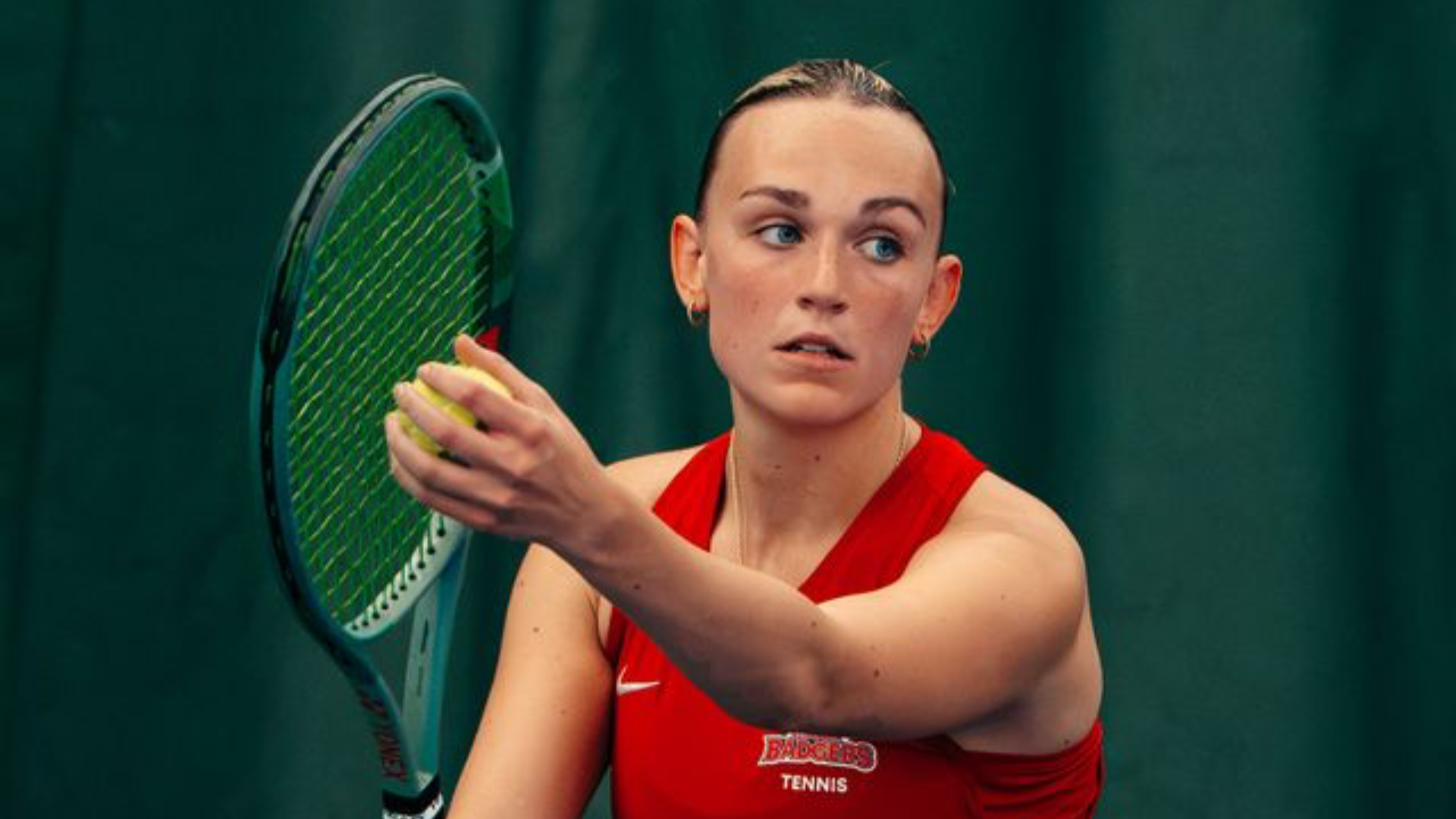 A Brock women's tennis player prepares to serve