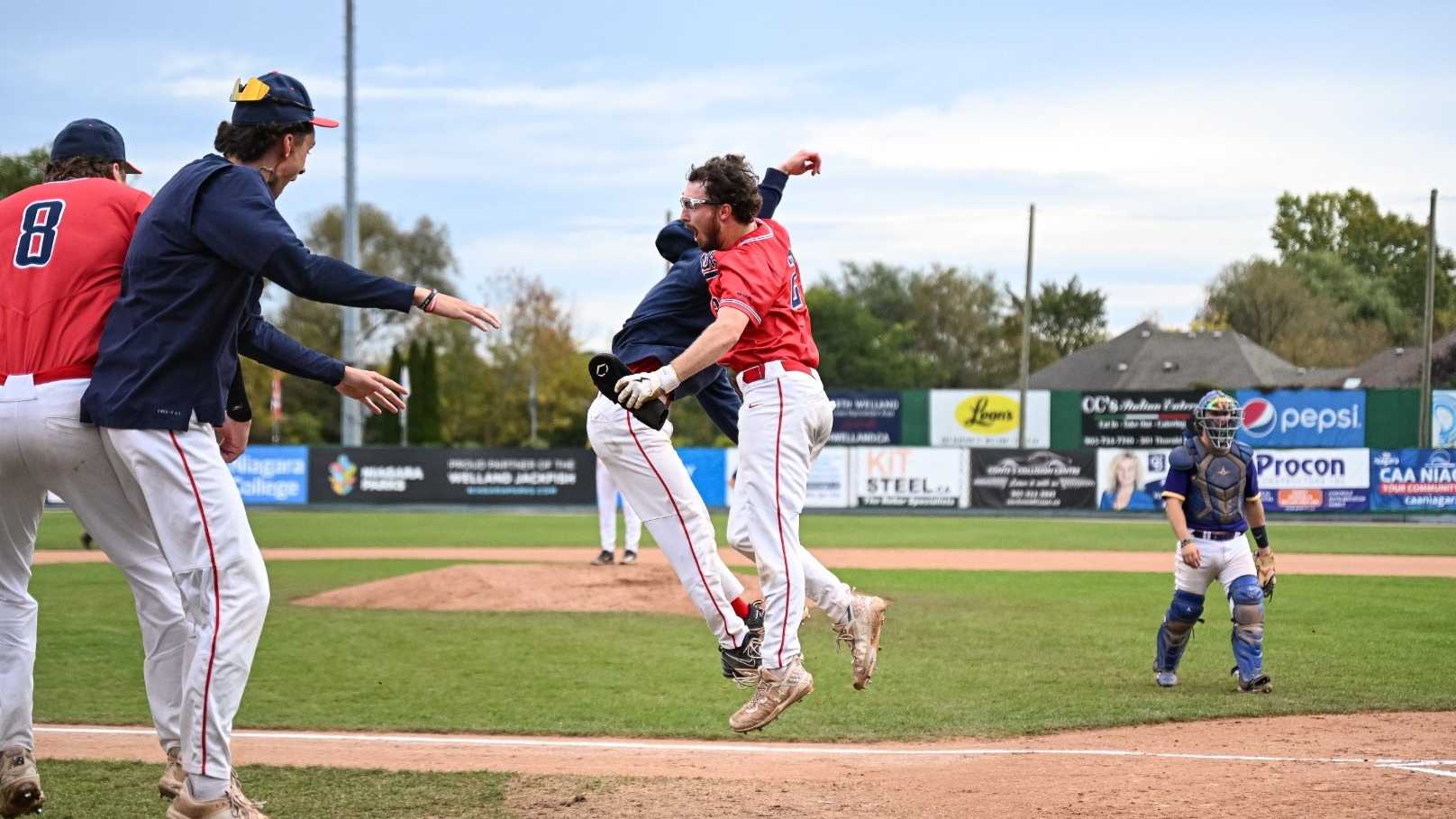 Gavin Taylor celebrates a home run at the 2026 OUA Baseball Championship