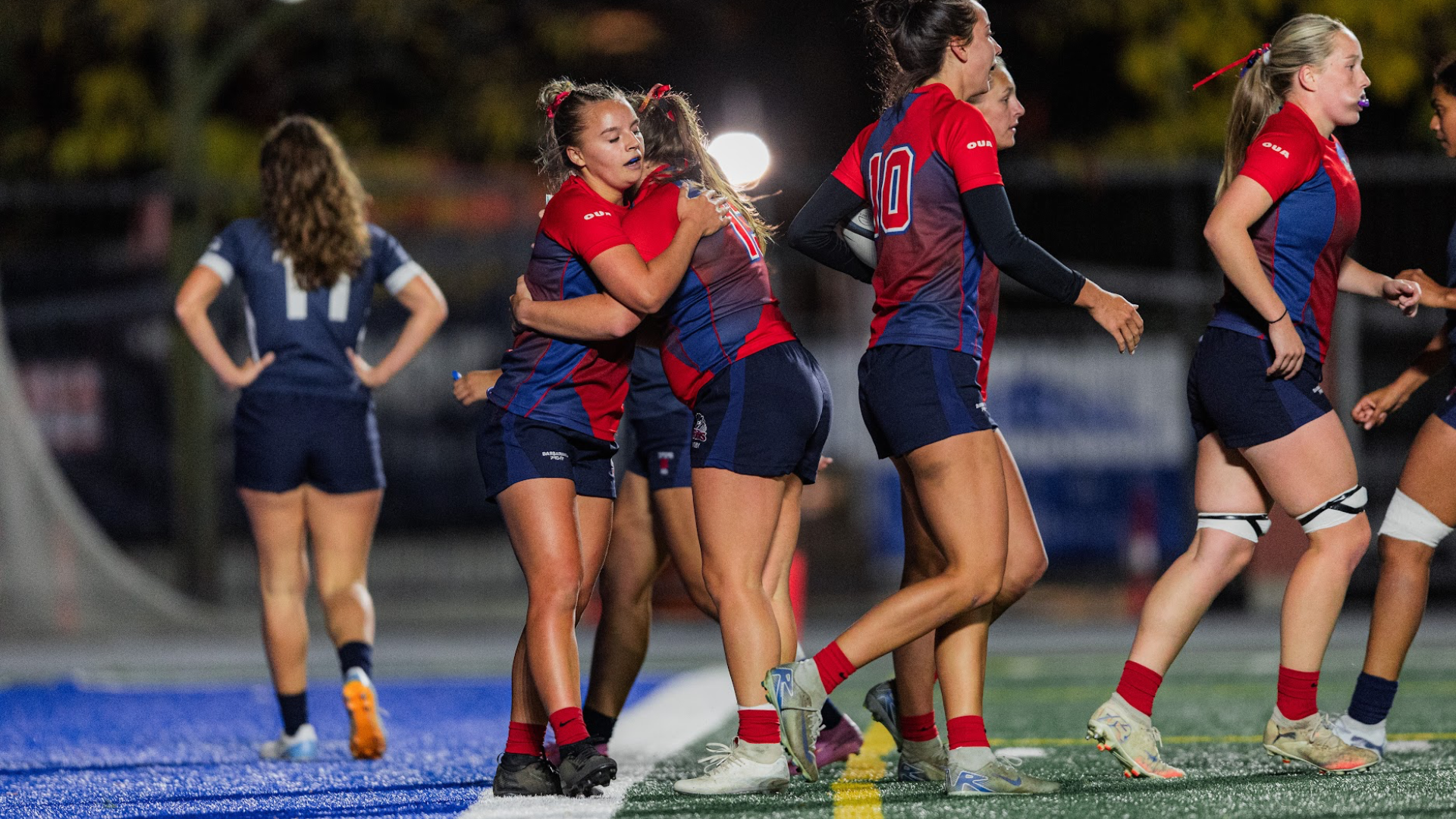 The Brock Badgers women's rugby team celebrates after a try